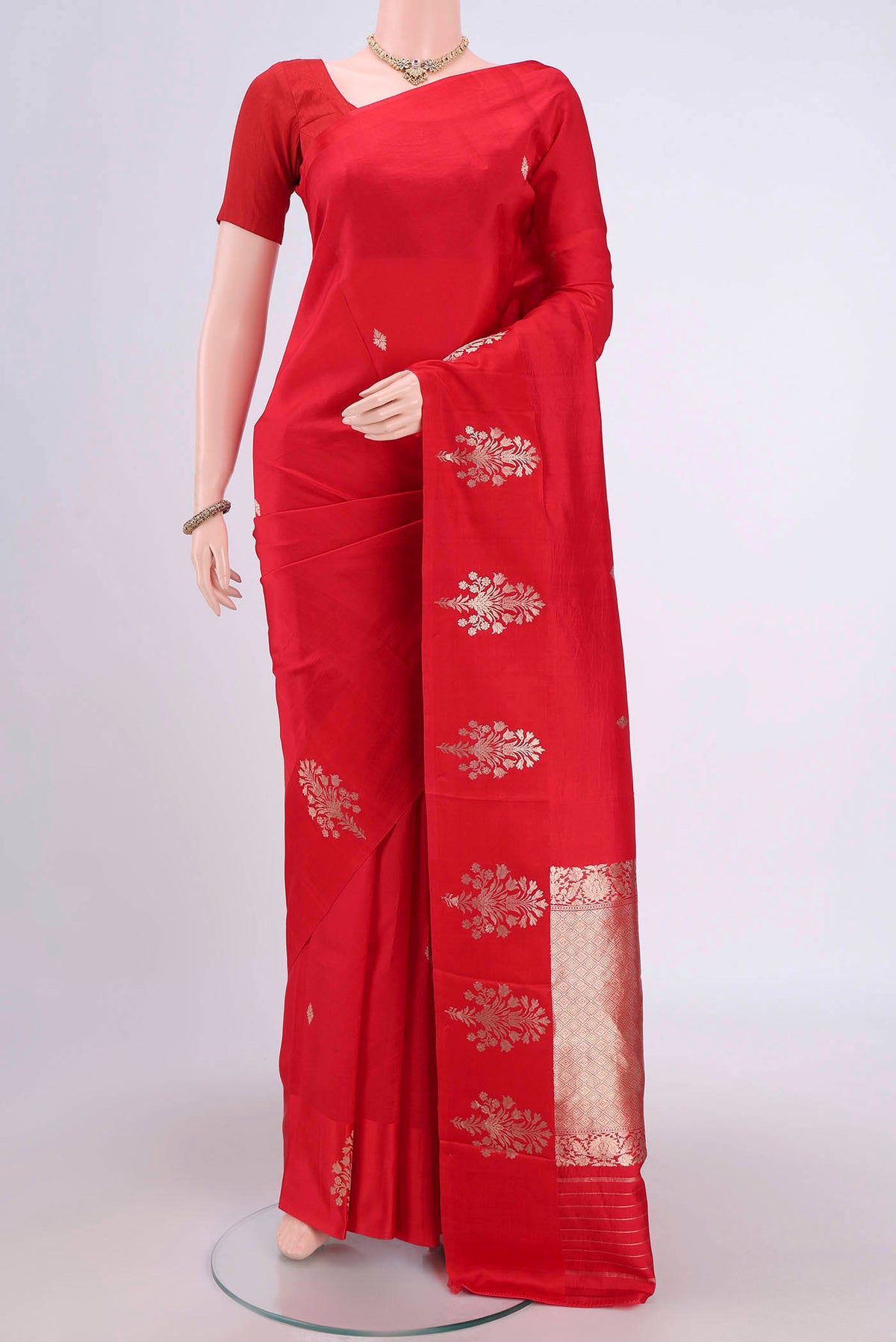 Red Banarasi Katan Silk Saree with Zari Butta on the body and Zari Border.  displayed on a mannequin