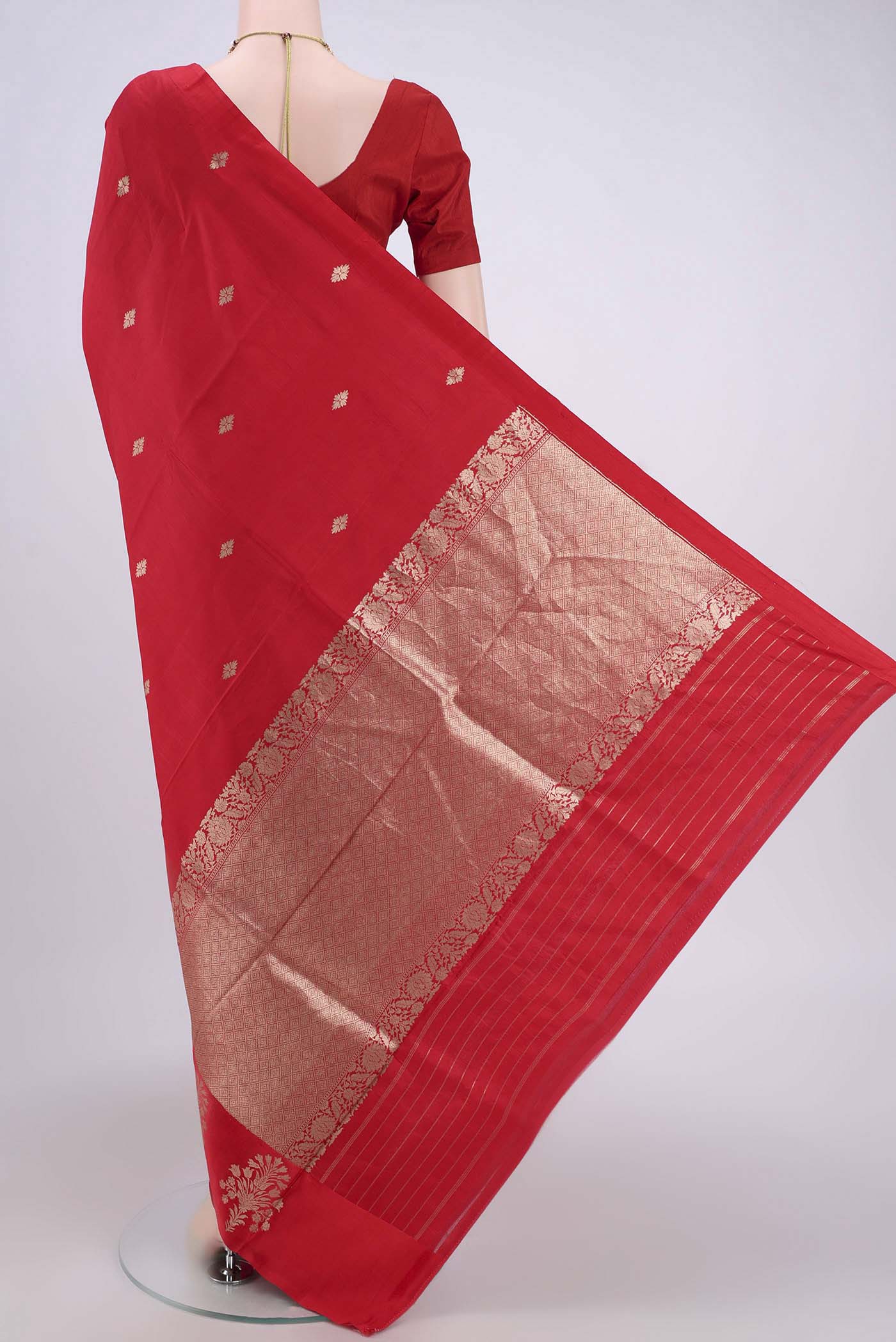 Flat view of Red Banarasi Katan Silk Saree with Zari Butta on the body and Zari Border. 