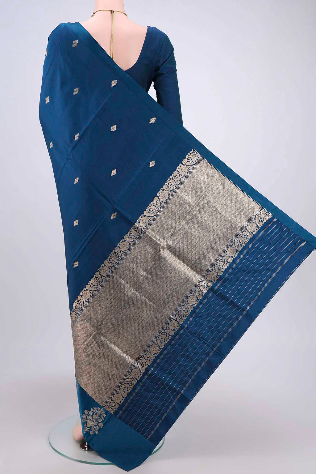 Flat view of Blue Banarasi Katan Silk Saree with Zari Butta on the body and Zari Border. 