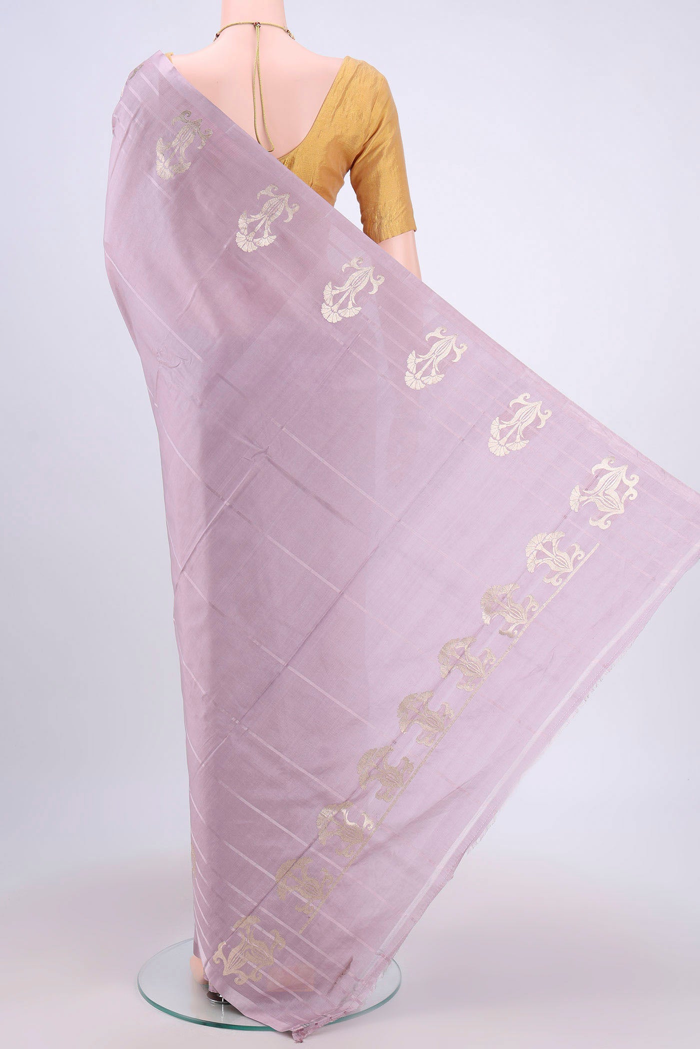 Flat view of Lilac Banarasi Katan Silk Saree with Plain Body and Zari Border. 