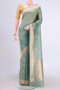 Sea Green Banarasi Tissue Silk Saree with Zari Butta on the body and Zari Border.  displayed on a mannequin