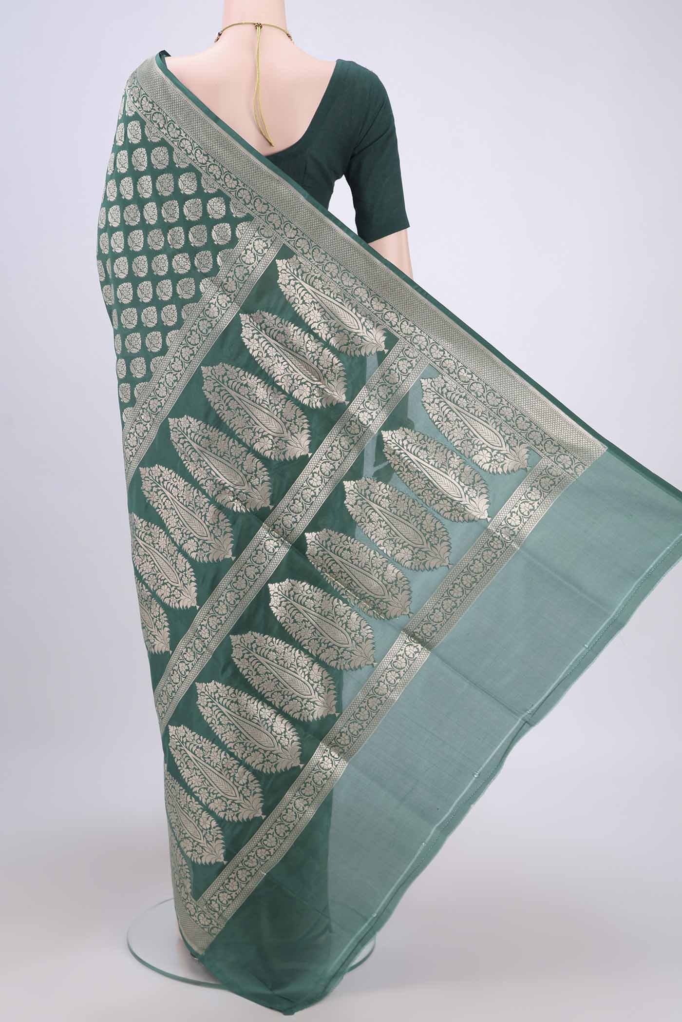 Flat view of Green Banarasi Jamavar Saree with Zari Brocade on the body and Zari Border. 