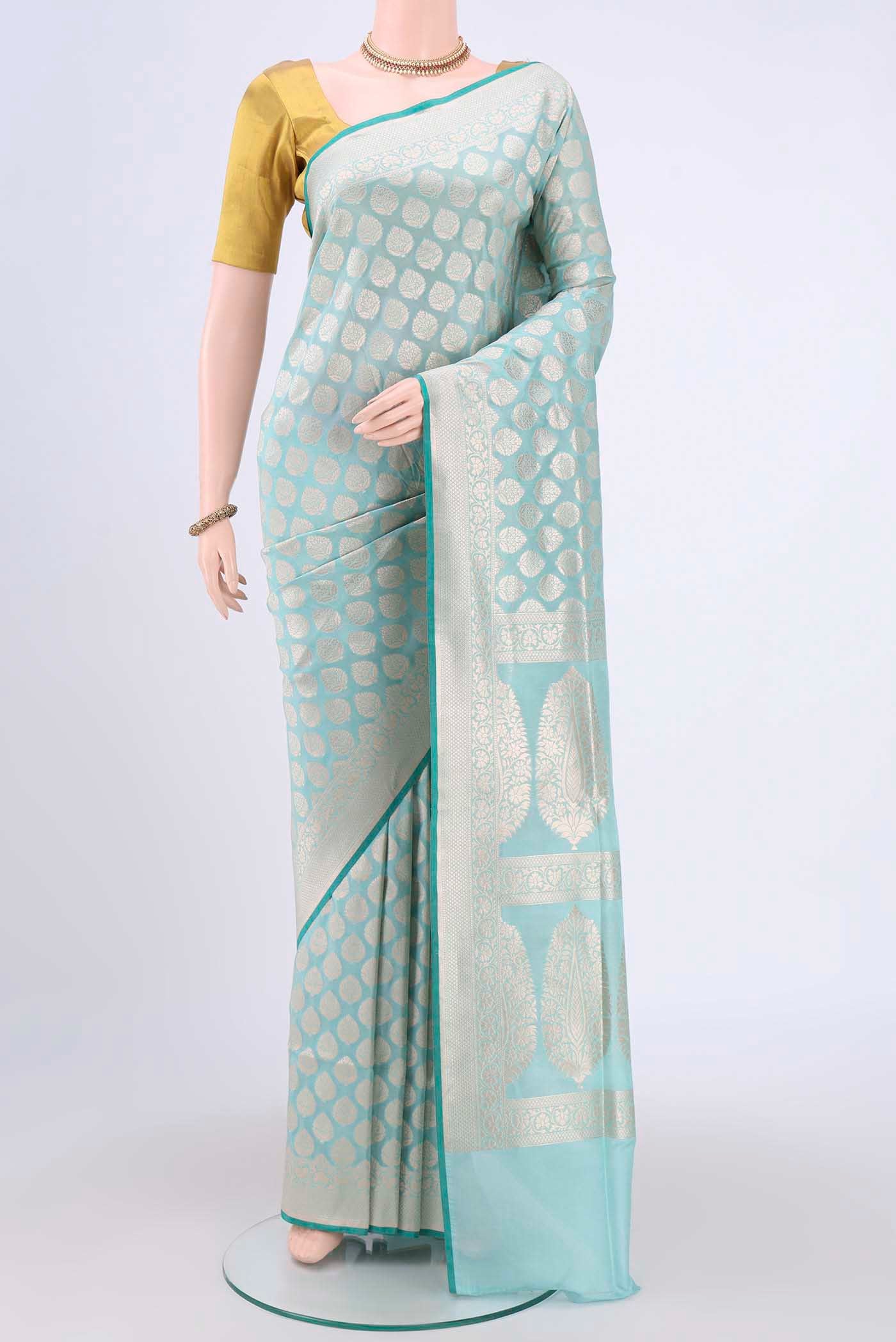 Sky Blue Dual Tone Banarasi Silk Saree with Zari Butta on the body and Zari Border.  displayed on a mannequin