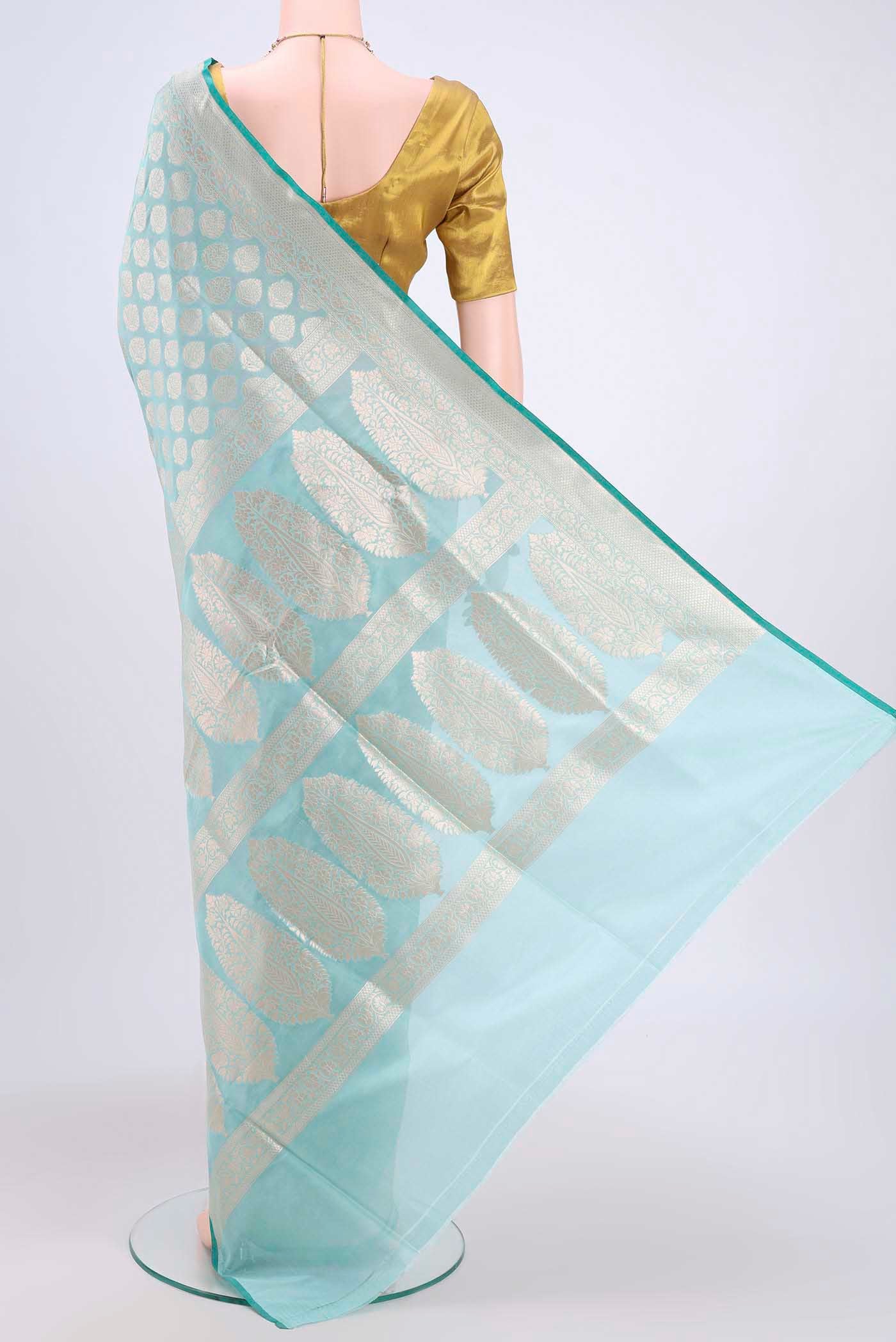 Flat view of Sky Blue Dual Tone Banarasi Silk Saree with Zari Butta on the body and Zari Border. 
