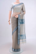 Davys Grey Maheshwari Silk Cotton Saree with Stripes on the body and Zari Border.  displayed on a mannequin