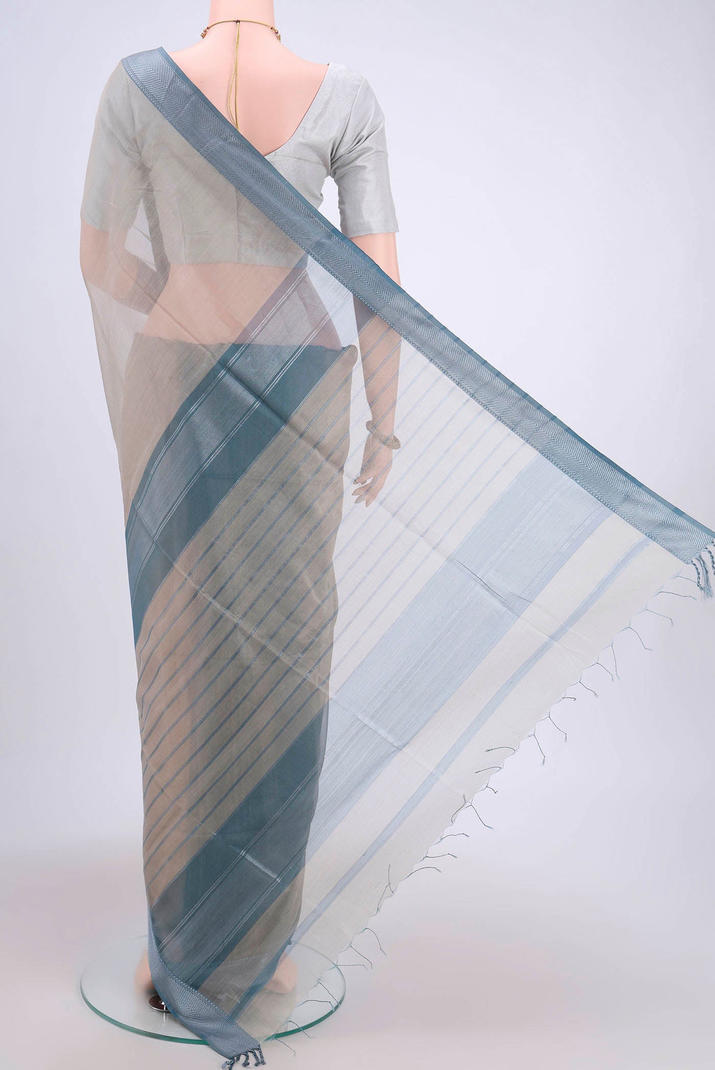 Flat view of Davys Grey Maheshwari Silk Cotton Saree with Stripes on the body and Zari Border. 