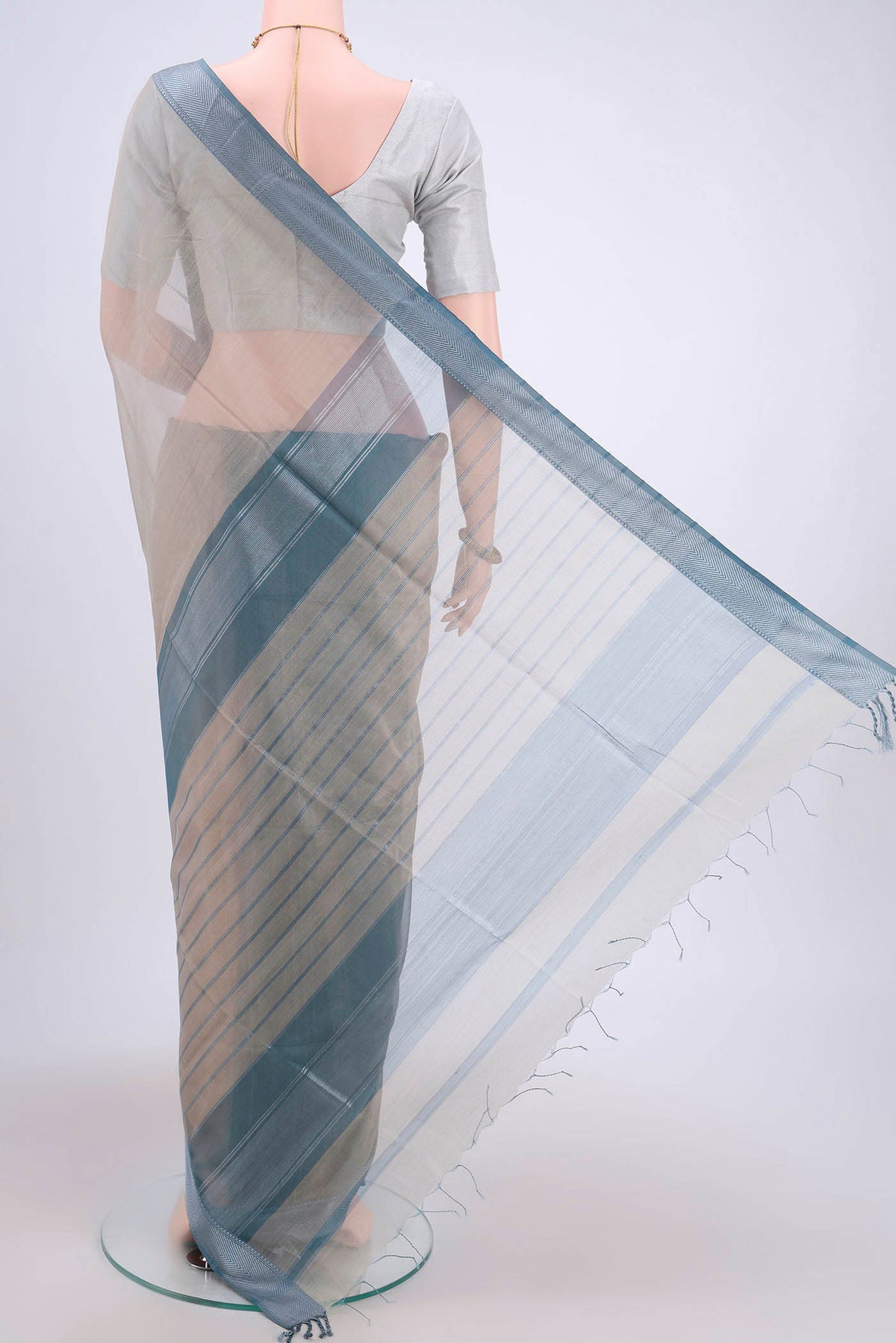 Flat view of Davys Grey Maheshwari Silk Cotton Saree with Stripes on the body and Zari Border. 