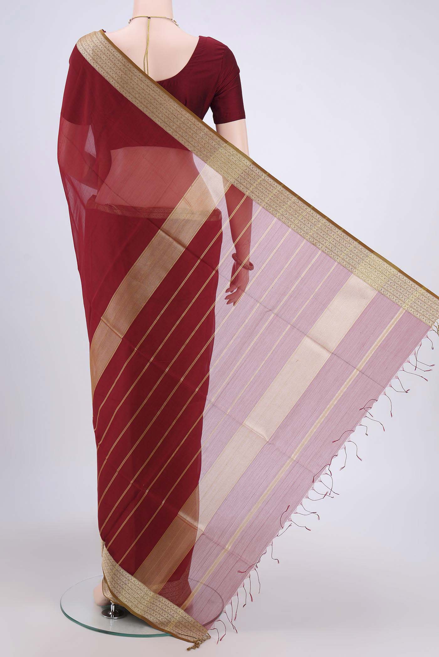 Flat view of Maroon Maheshwari Silk Cotton Saree with Plain Body and Thread Border. 