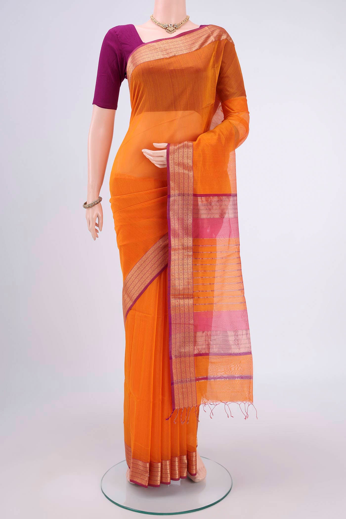 Yellow Dual Tone Maheshwari Silk Cotton Saree with Plain Body and Zari Border.  displayed on a mannequin