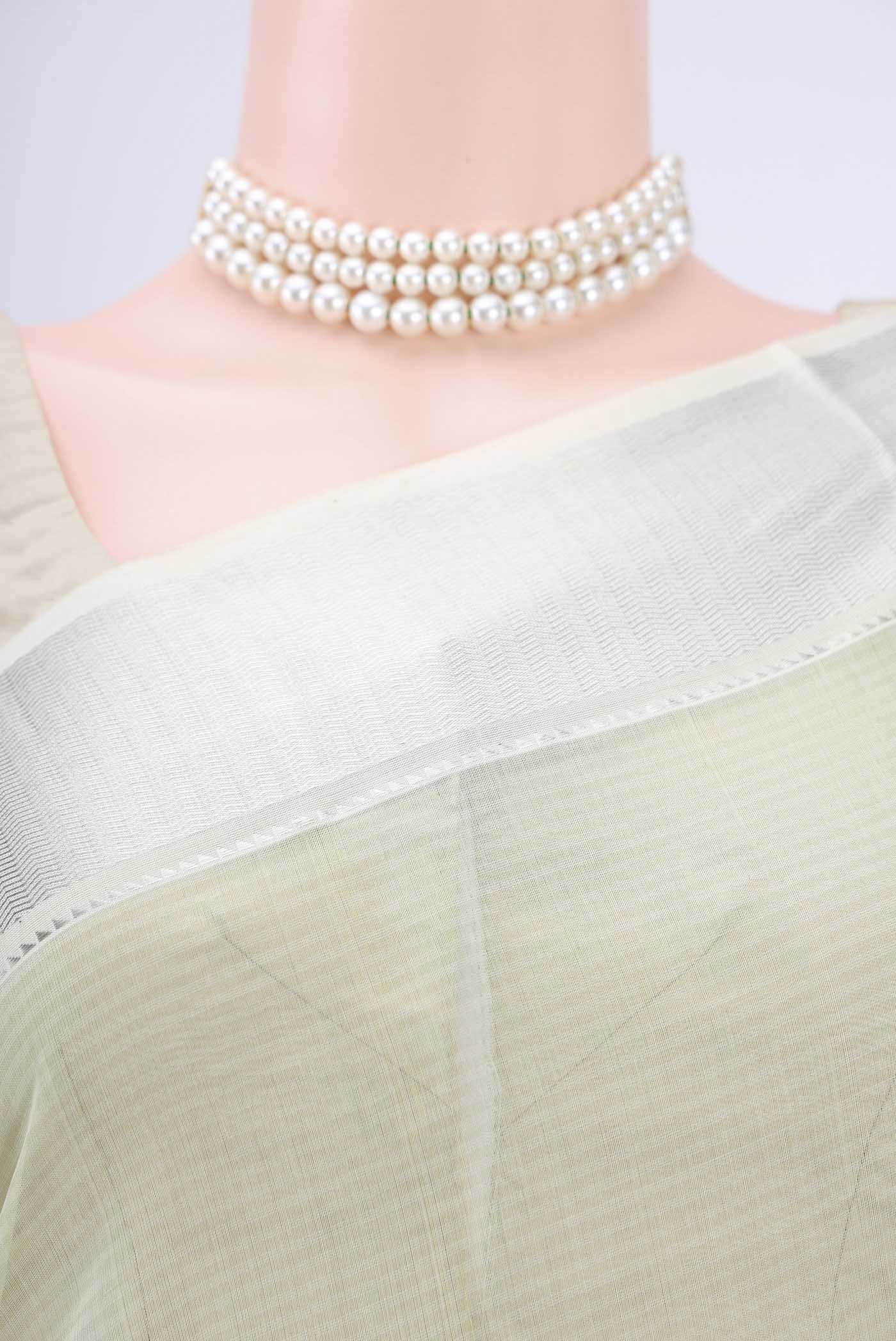 Border image of Sage Green Maheshwari Silk Cotton Saree with Plain Body and Zari Border. 