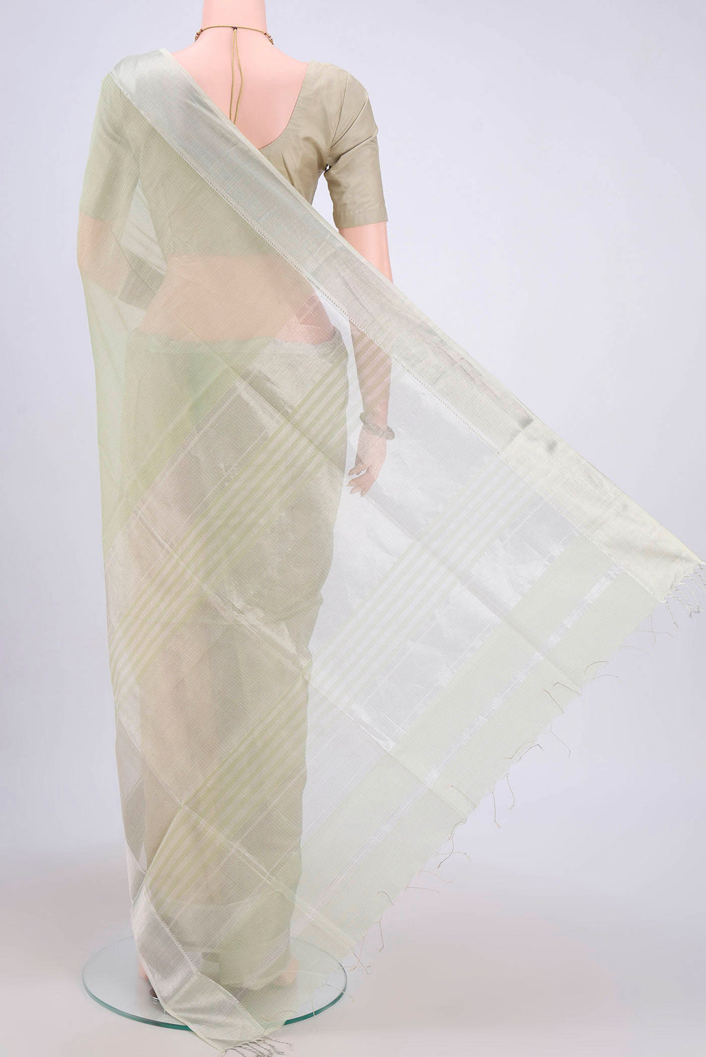 Flat view of Sage Green Maheshwari Silk Cotton Saree with Plain Body and Zari Border. 