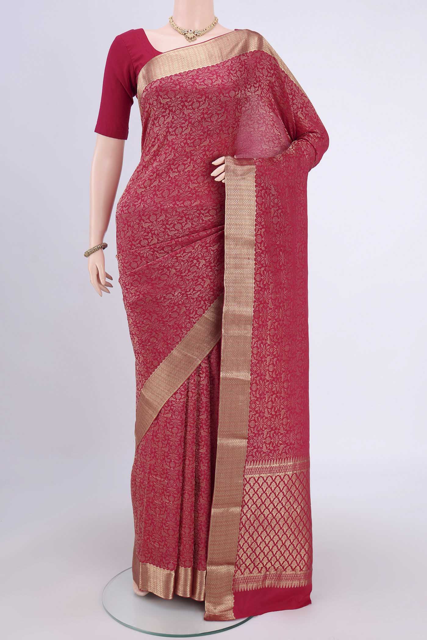 Dark Pink Mysore Crepe Saree with Zari Brocade on the body and Zari Border.  displayed on a mannequin