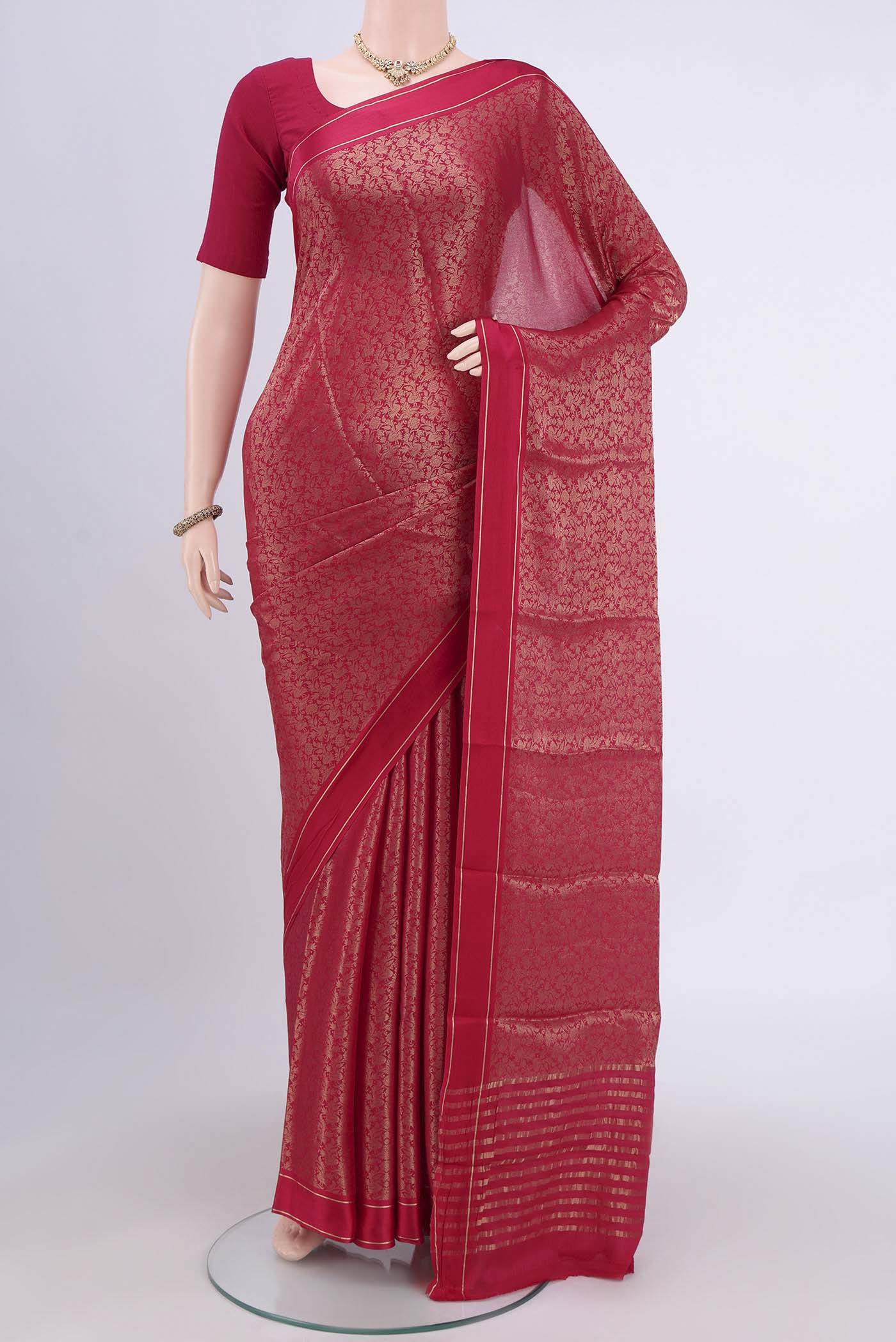 Dark Pink Mysore Crepe Saree with Zari Brocade on the body and Zari Border.  displayed on a mannequin