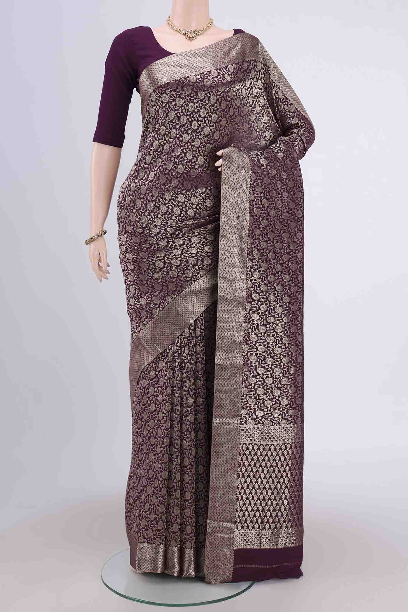 Burgundy Mysore Crepe Saree with Zari Brocade on the body and Zari Border.  displayed on a mannequin