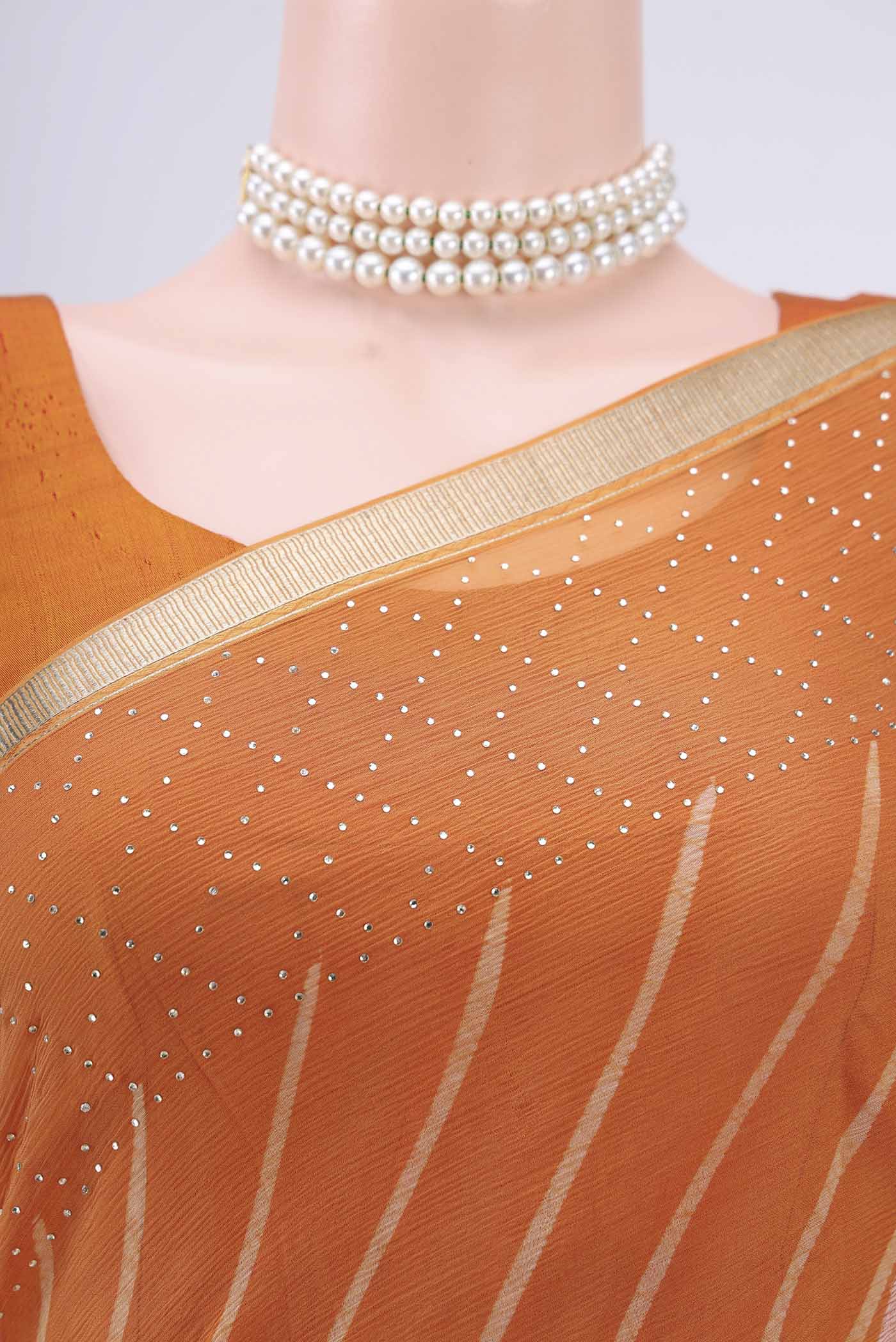 Border image of Brick Orange Mysore Chiffon Saree with Printed design on the body and Zari Border. 