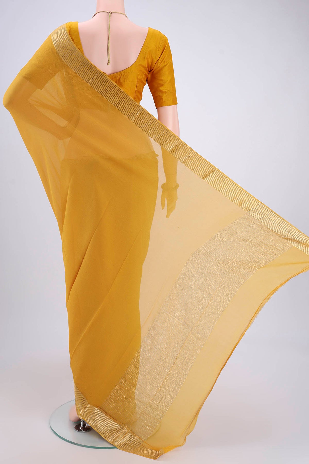 Flat view of Yellow Mysore Chiffon Saree with Plain Body and Zari Border. 