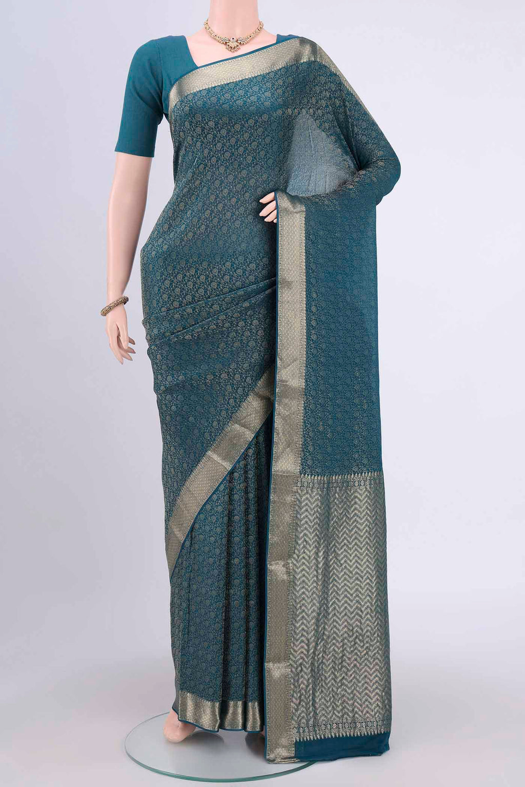 Blue Mysore Crepe Saree with Zari Brocade on the body and Zari Border.  displayed on a mannequin