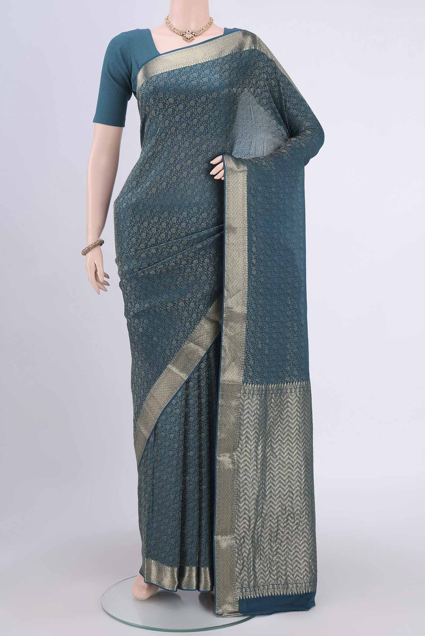Blue Mysore Crepe Saree with Zari Brocade on the body and Zari Border.  displayed on a mannequin