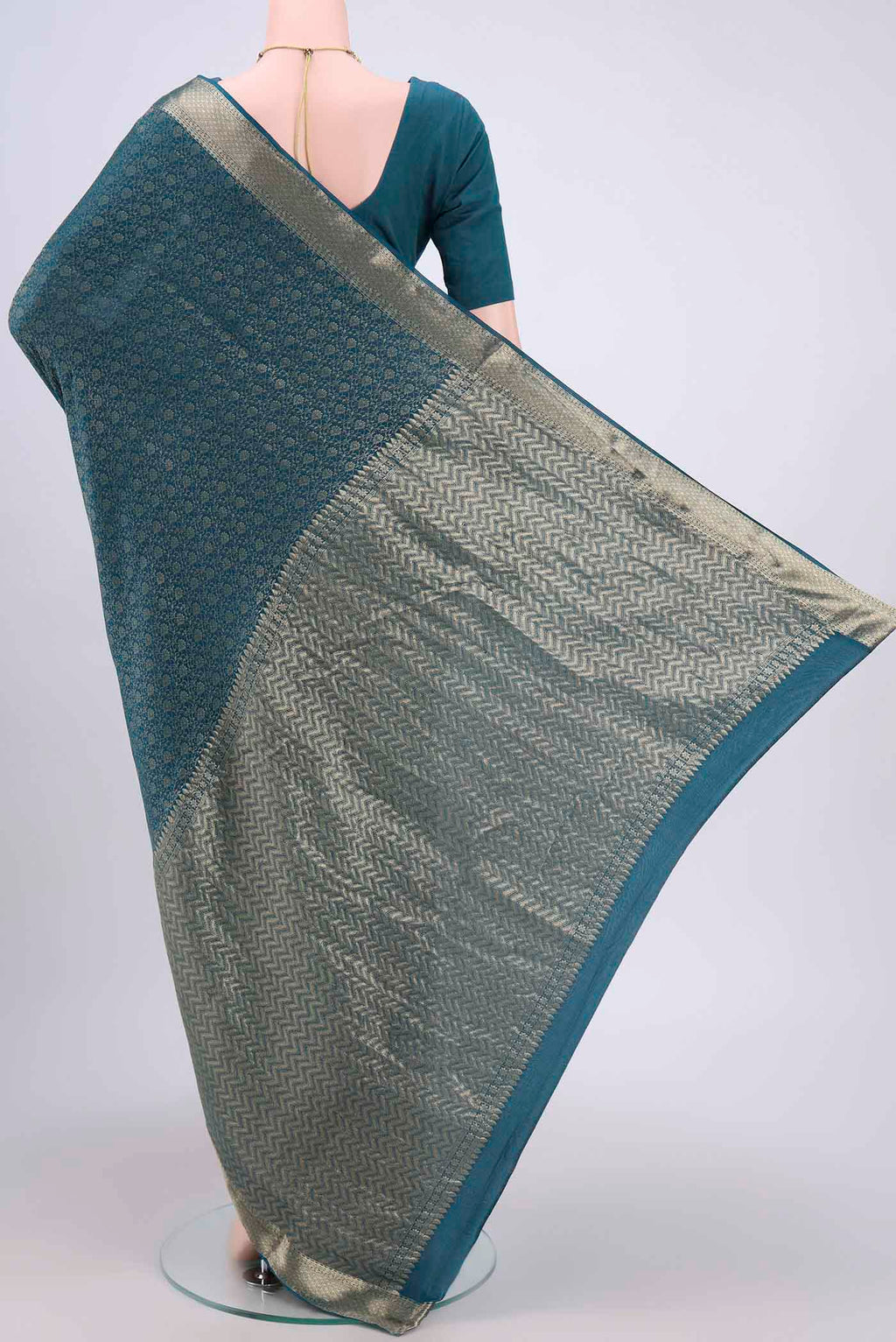 Flat view of Blue Mysore Crepe Saree with Zari Brocade on the body and Zari Border. 