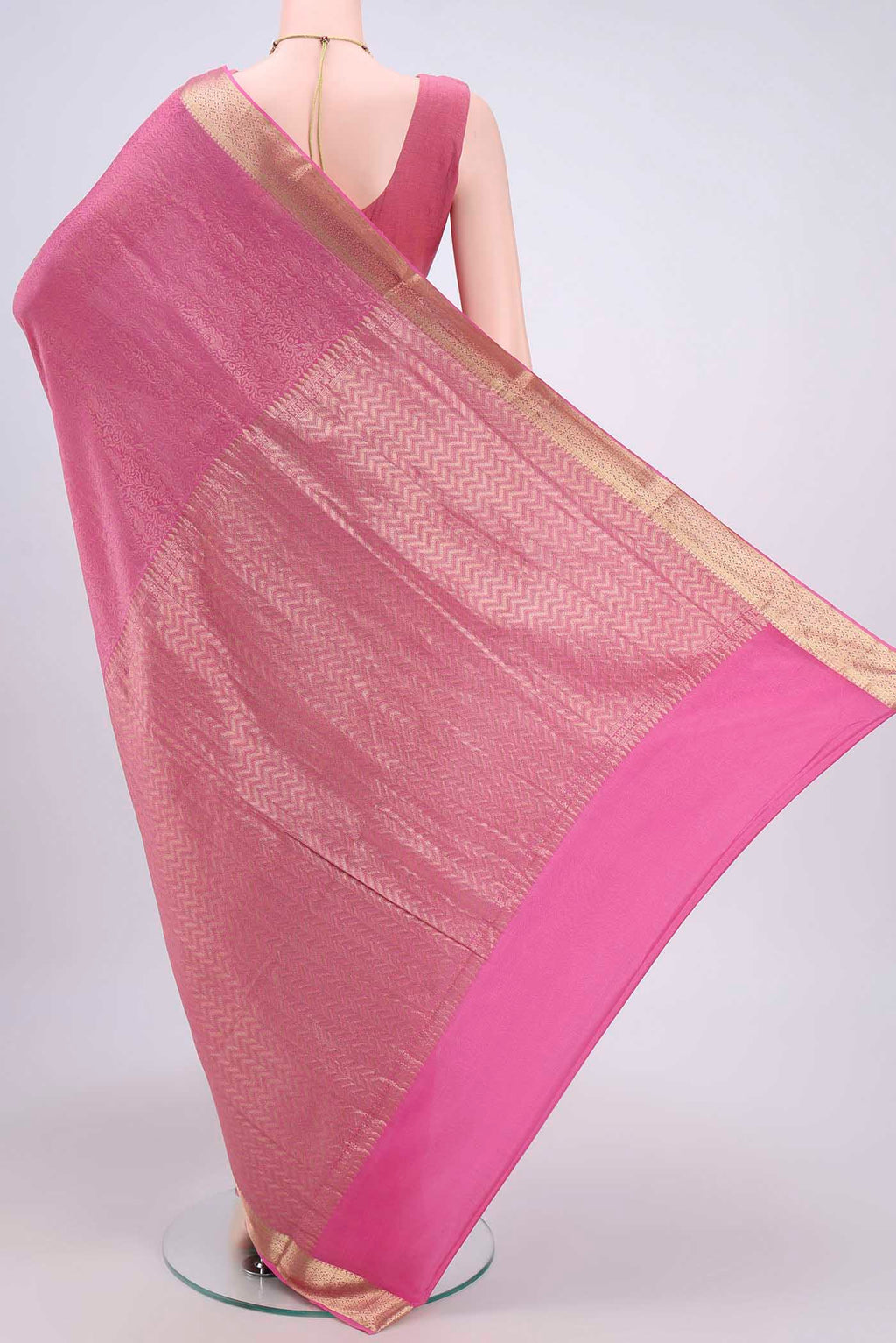 Flat view of Rani Pink Mysore Crepe Saree with Zari Brocade on the body and Zari Border. 