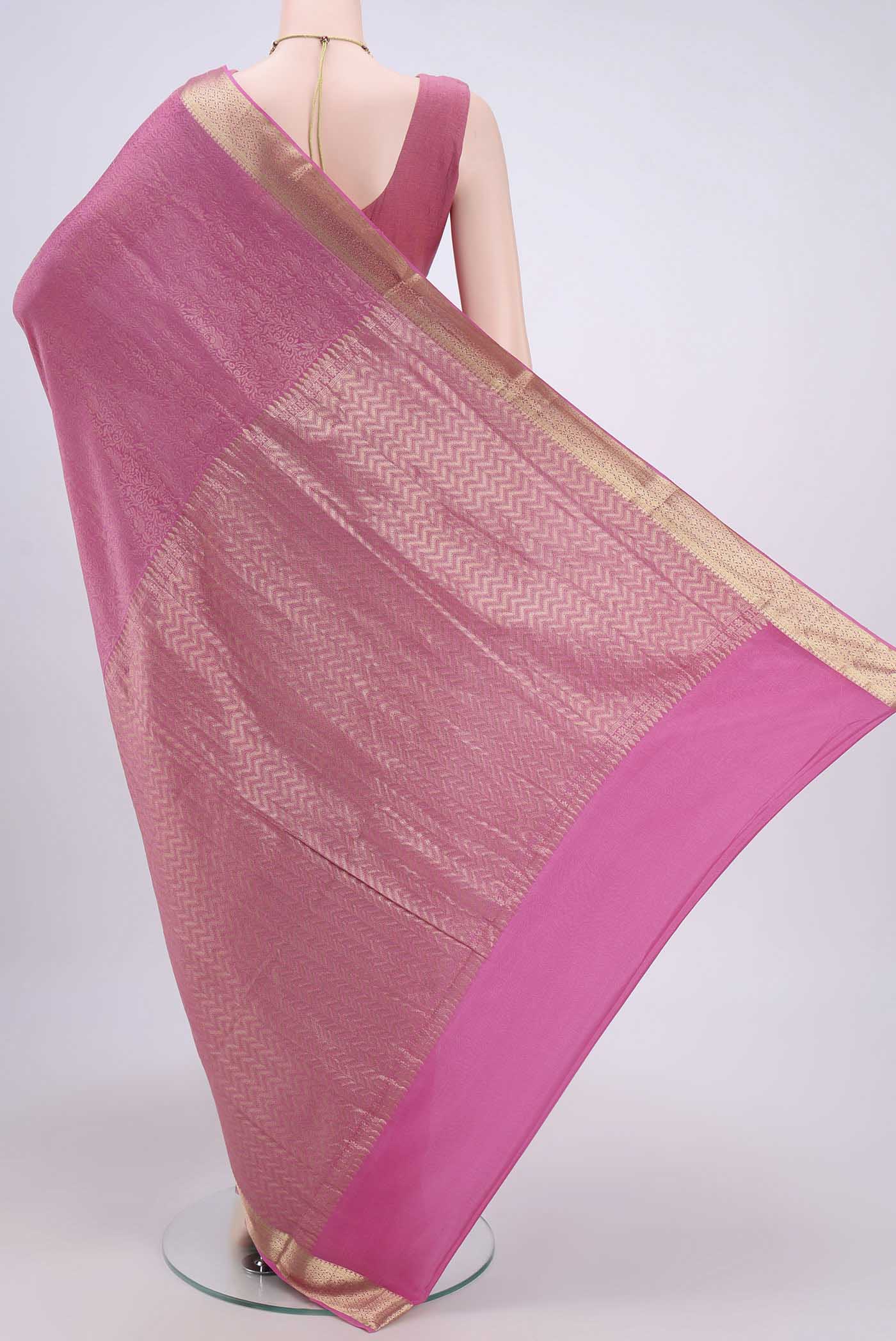 Flat view of Rani Pink Mysore Crepe Saree with Zari Brocade on the body and Zari Border. 