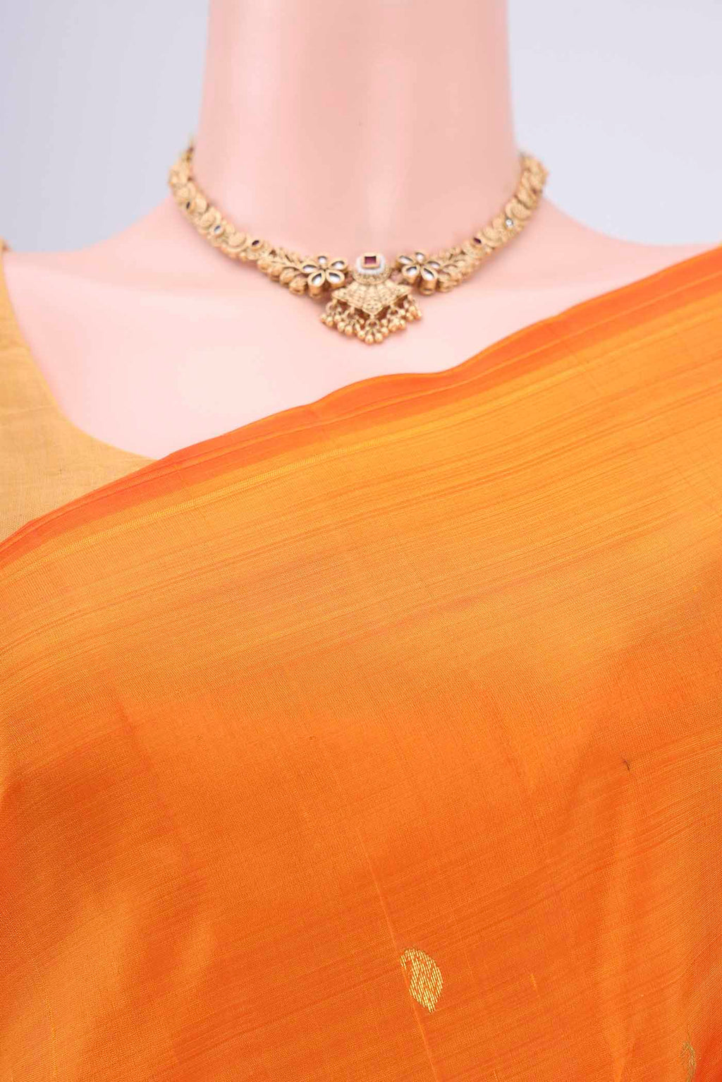 Border image of Orange Kanjivaram Silk Saree with Zari Butta on the body and One Side Border. 