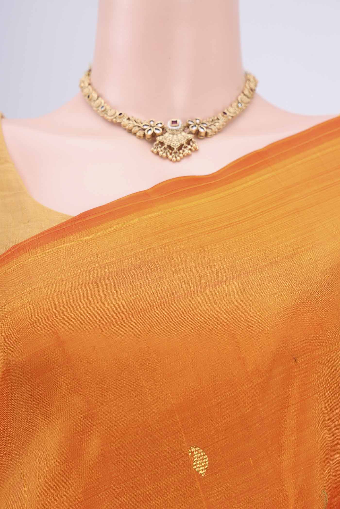 Border image of Orange Kanjivaram Silk Saree with Zari Butta on the body and One Side Border. 