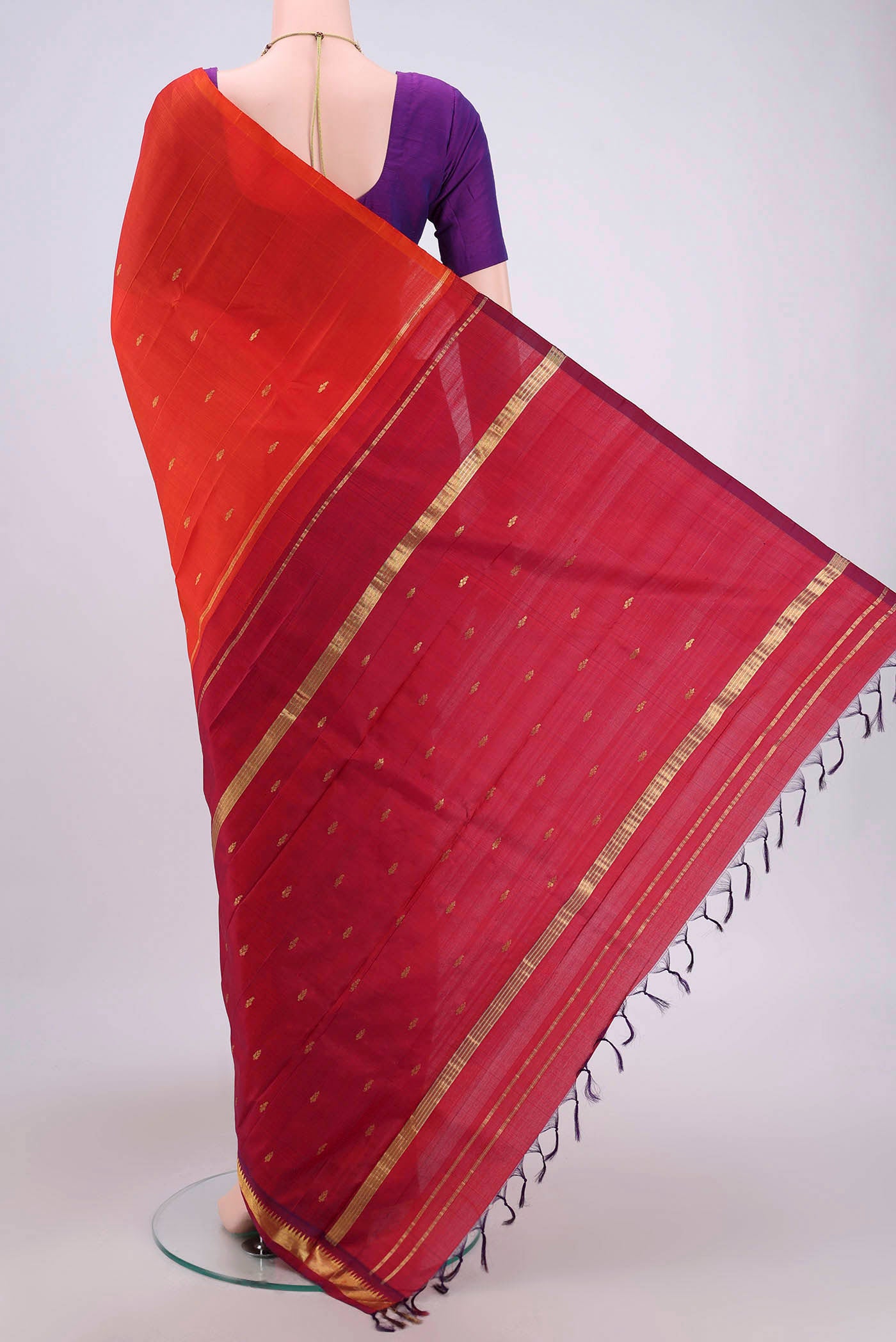 Flat view of Orange Kanjivaram Silk Saree with Zari Butta on the body and One Side Border. 
