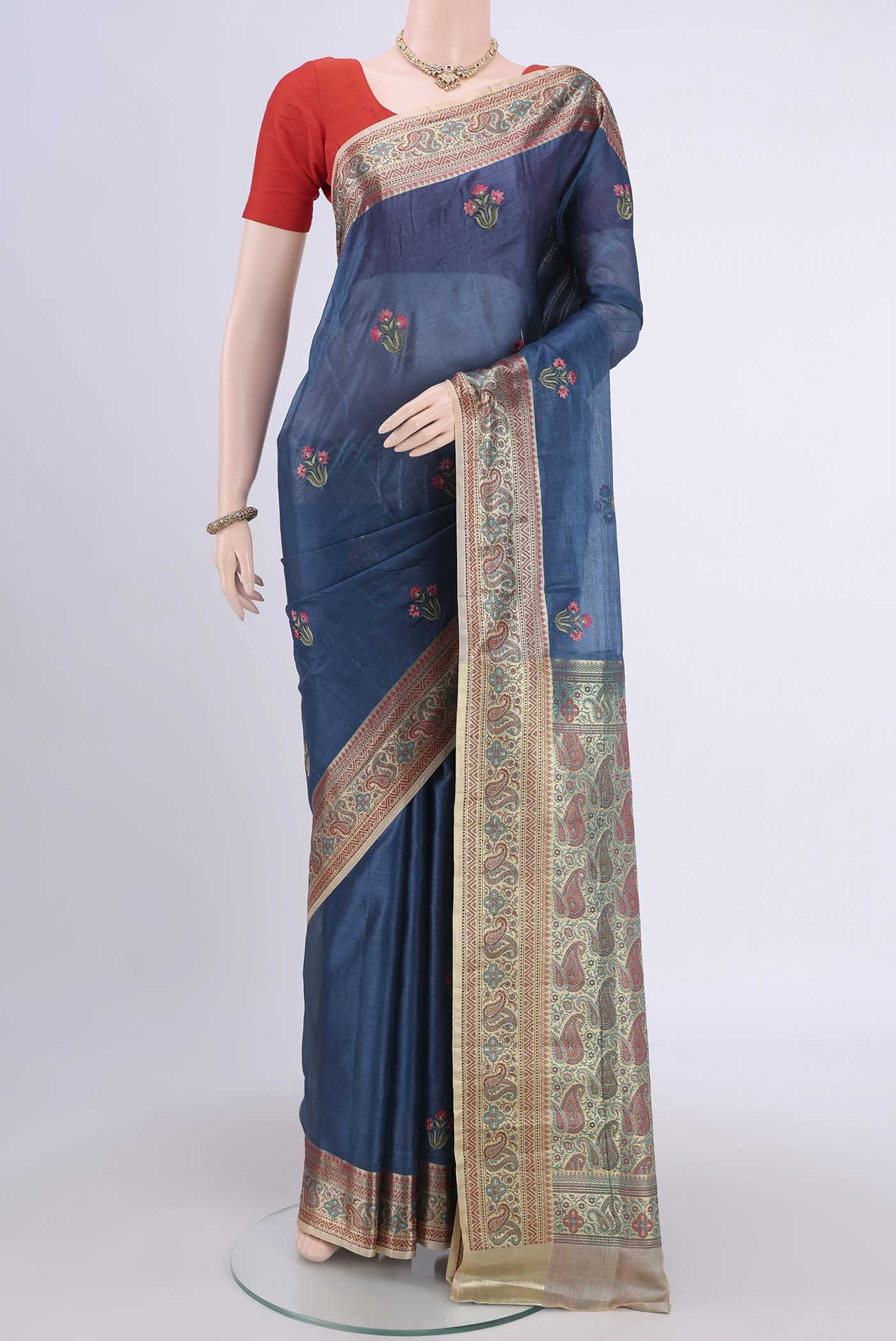 Blue Banarasi Raw Silk Saree with Embroidery on the body and Zari Border.  displayed on a mannequin
