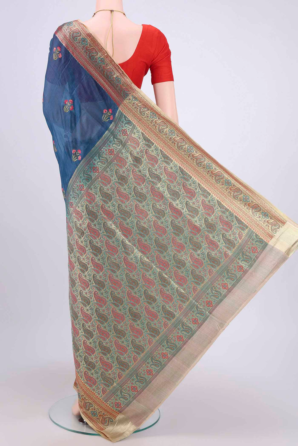 Flat view of Blue Banarasi Raw Silk Saree with Embroidery on the body and Zari Border. 