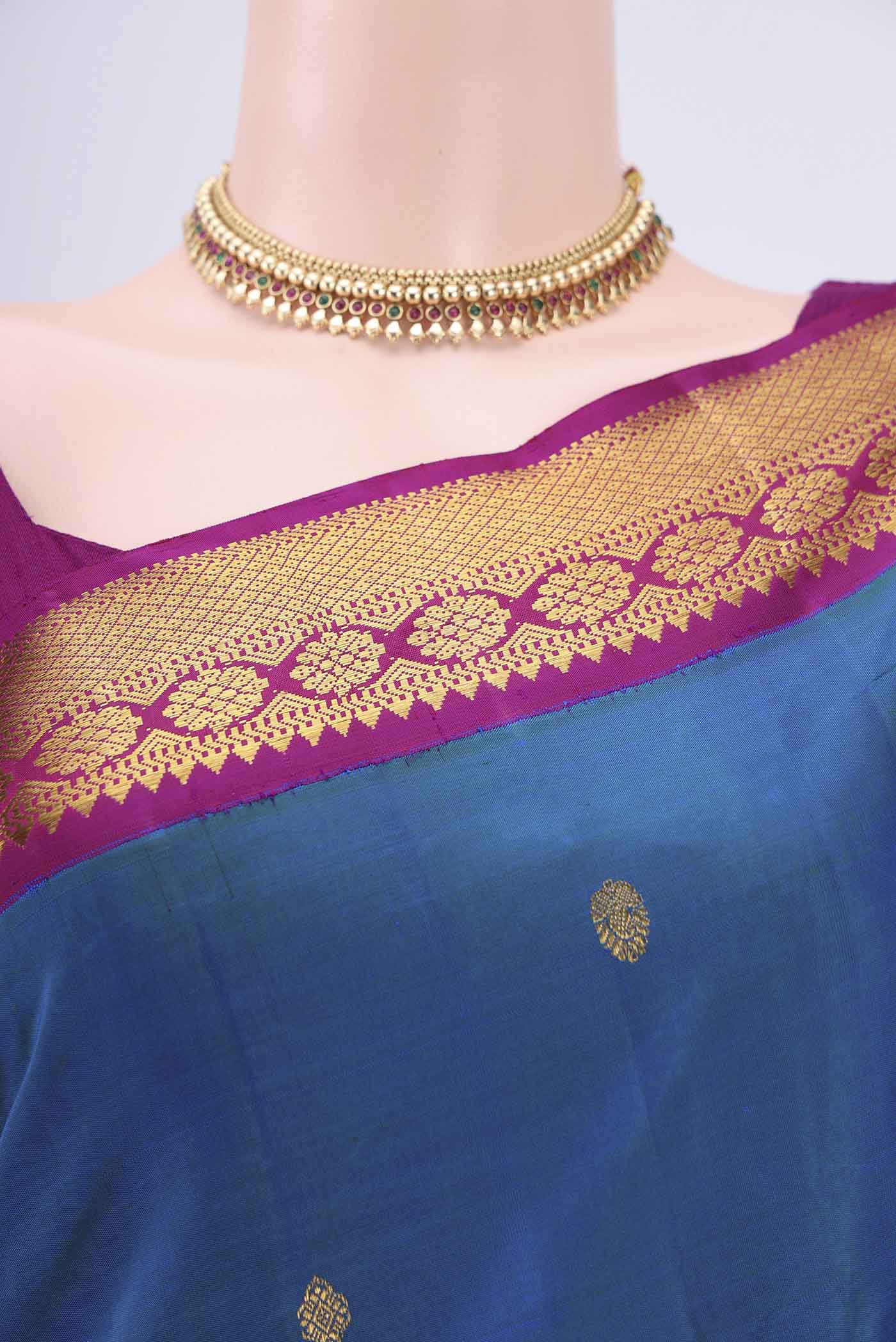 Border image of Peacock Blue Kanchipuram Saree with Zari Butta on the body and Zari Border. 