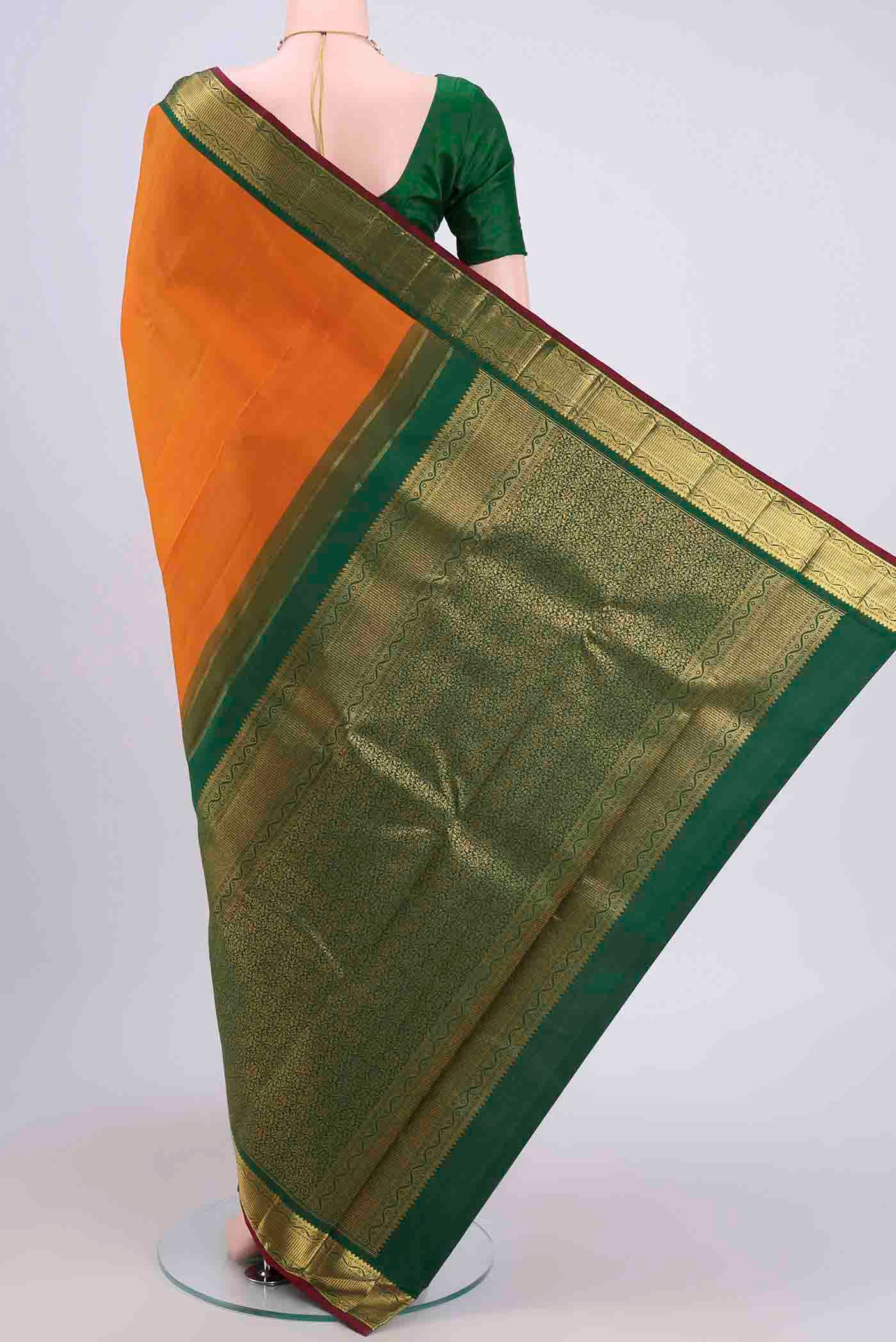 Flat view of Yellow Kanchipuram Saree with Plain Body and Zari Border. 