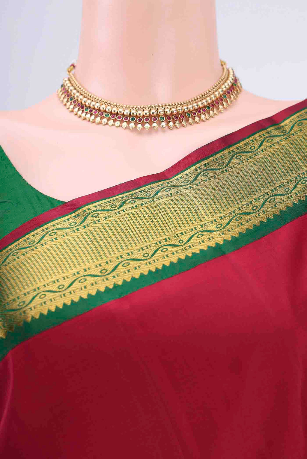Border image of Maroon Kanchipuram Saree with Plain Body and Zari Border. 