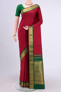 Maroon Kanchipuram Saree with Plain Body and Zari Border.  displayed on a mannequin