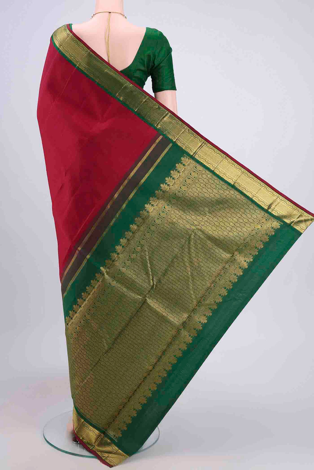 Flat view of Maroon Kanchipuram Saree with Plain Body and Zari Border. 