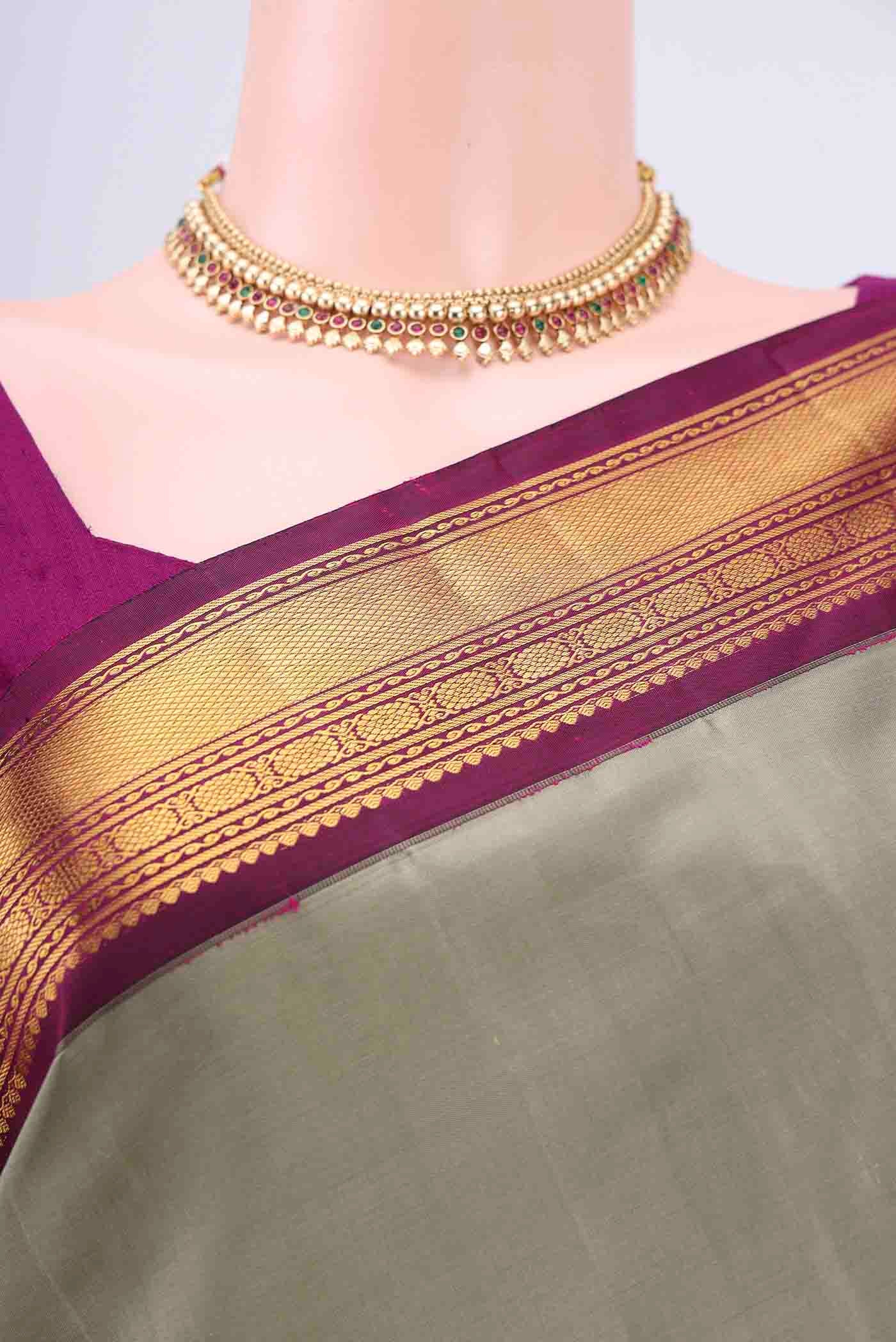 Border image of Sage Green Kanchipuram Saree with Plain Body and Zari Border. 