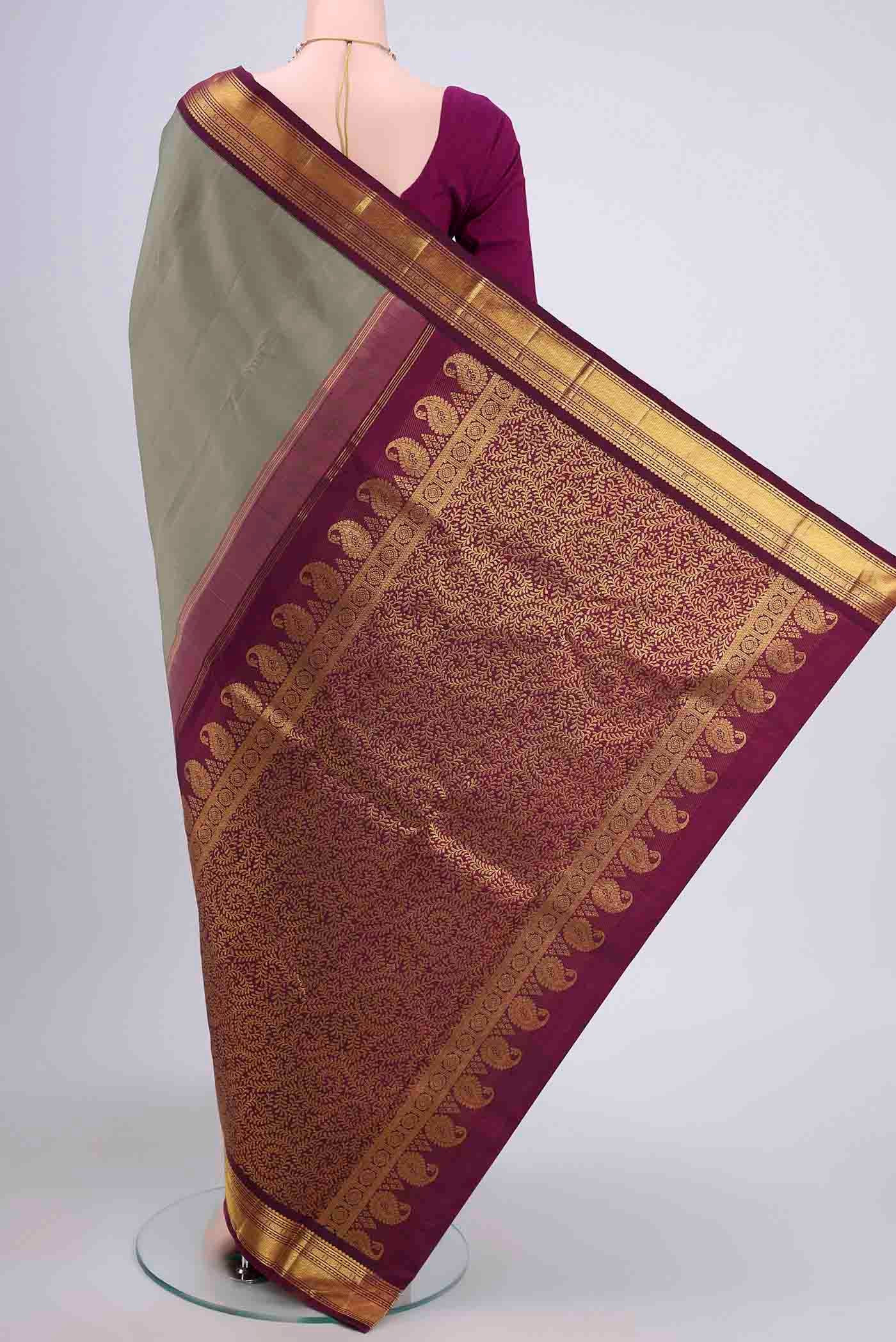 Flat view of Sage Green Kanchipuram Saree with Plain Body and Zari Border. 