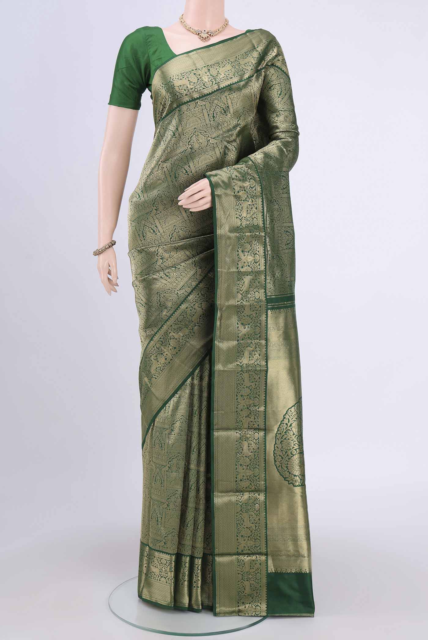 Bottle Green Dual Tone Bangalore Silk Saree with Zari Brocade on the body and Zari Border.  displayed on a mannequin