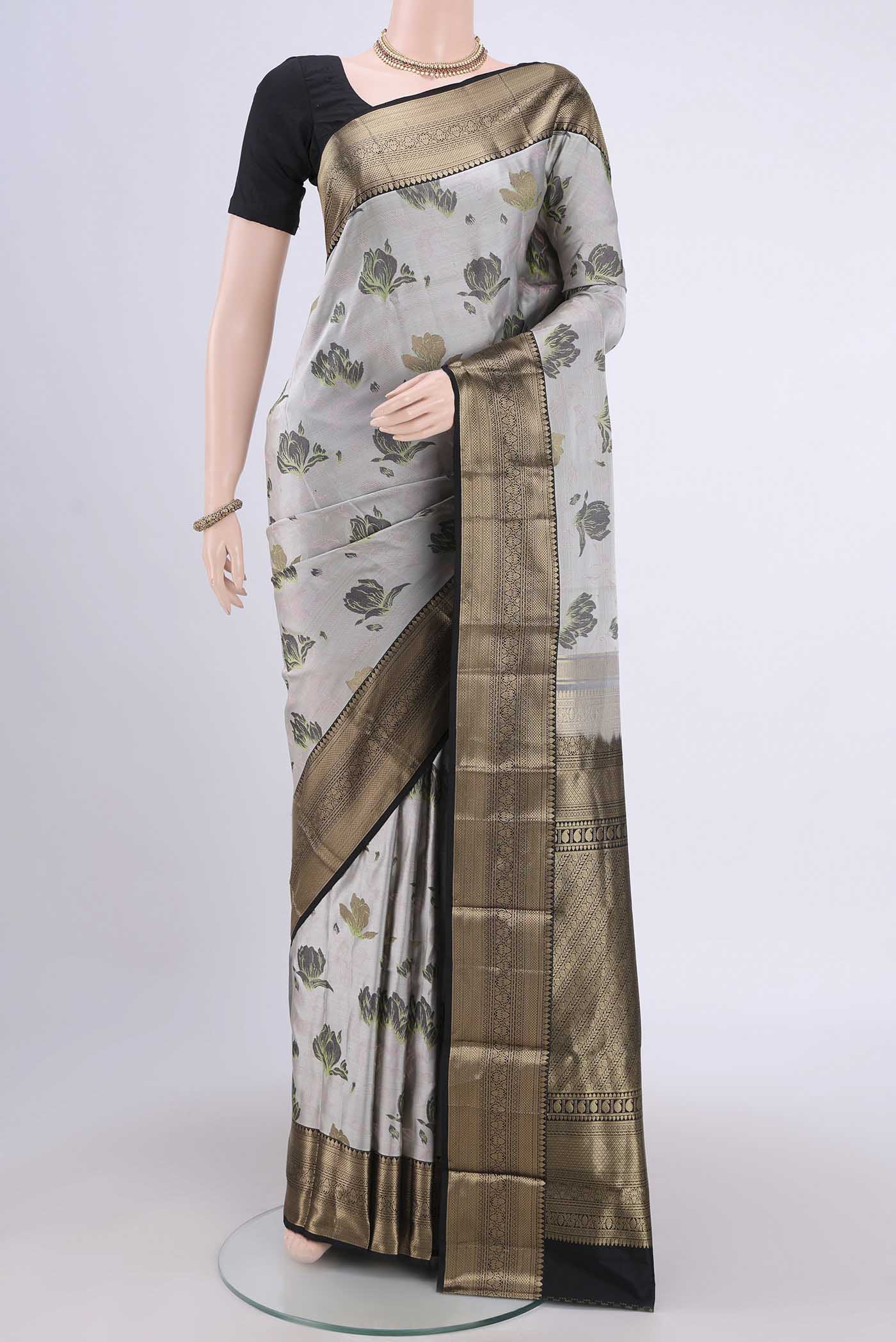 Silver Bangalore Silk Saree with Printed design on the body and Zari Border.  displayed on a mannequin
