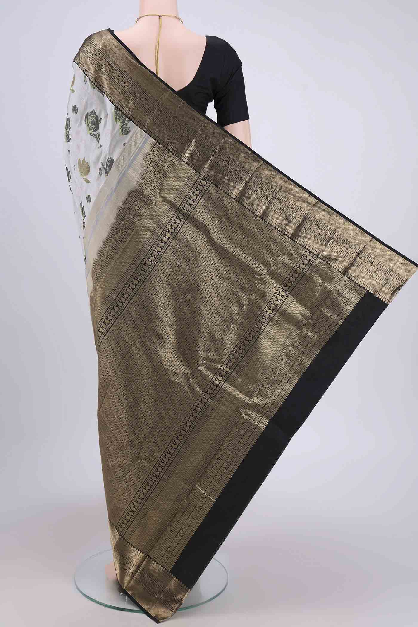 Flat view of Silver Bangalore Silk Saree with Printed design on the body and Zari Border. 