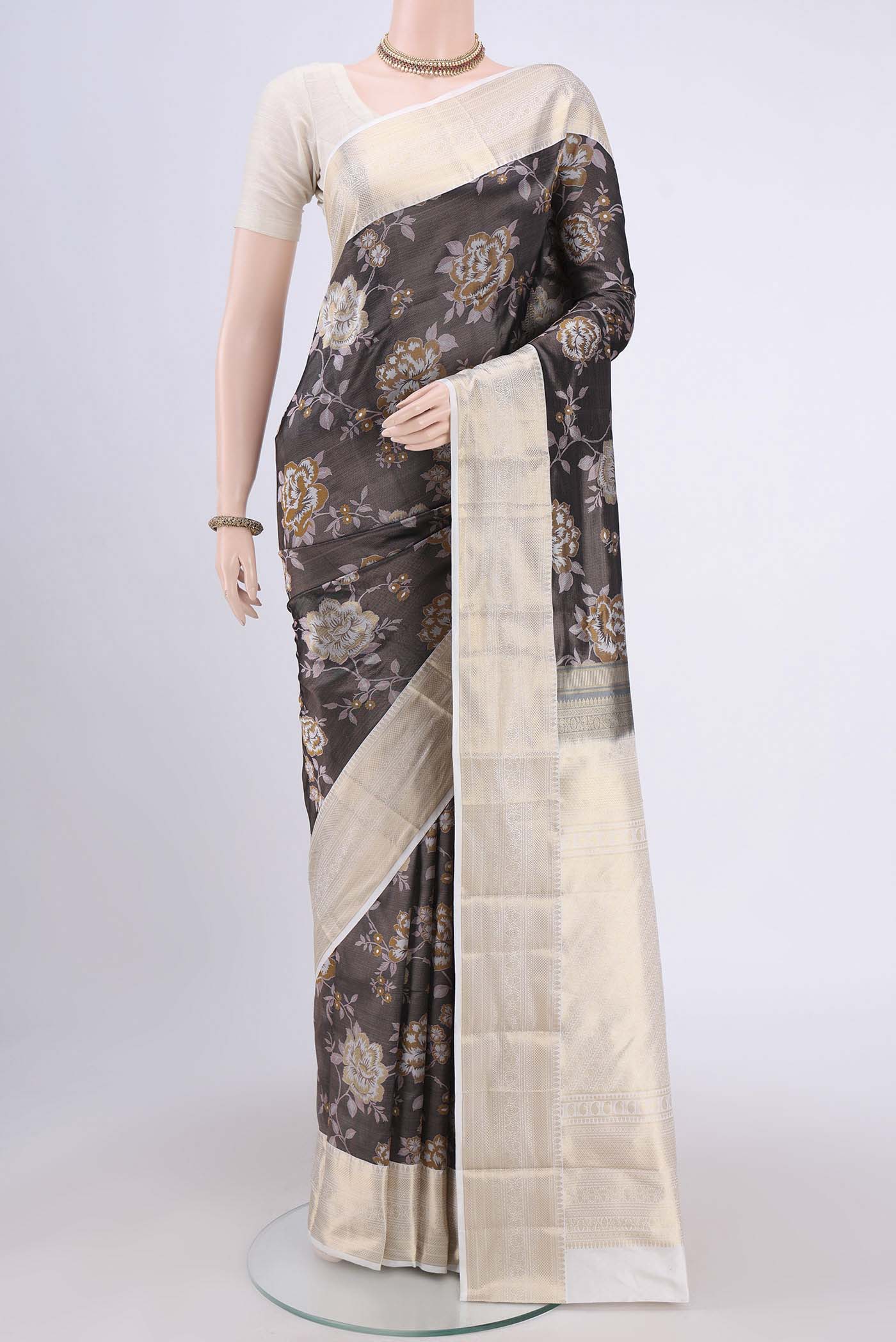 Black Bangalore Silk Saree with Printed design on the body and Zari Border.  displayed on a mannequin