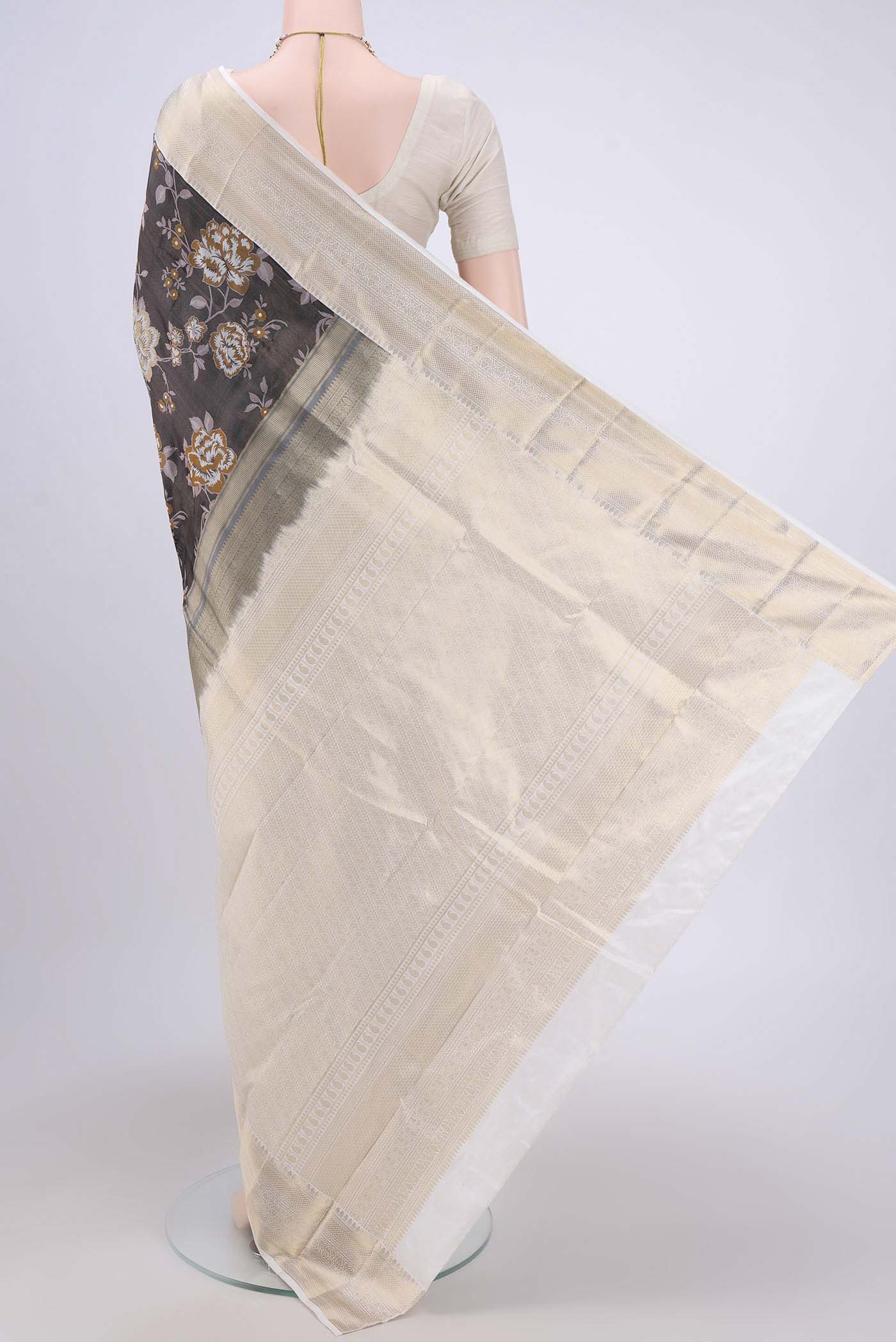Flat view of Black Bangalore Silk Saree with Printed design on the body and Zari Border. 
