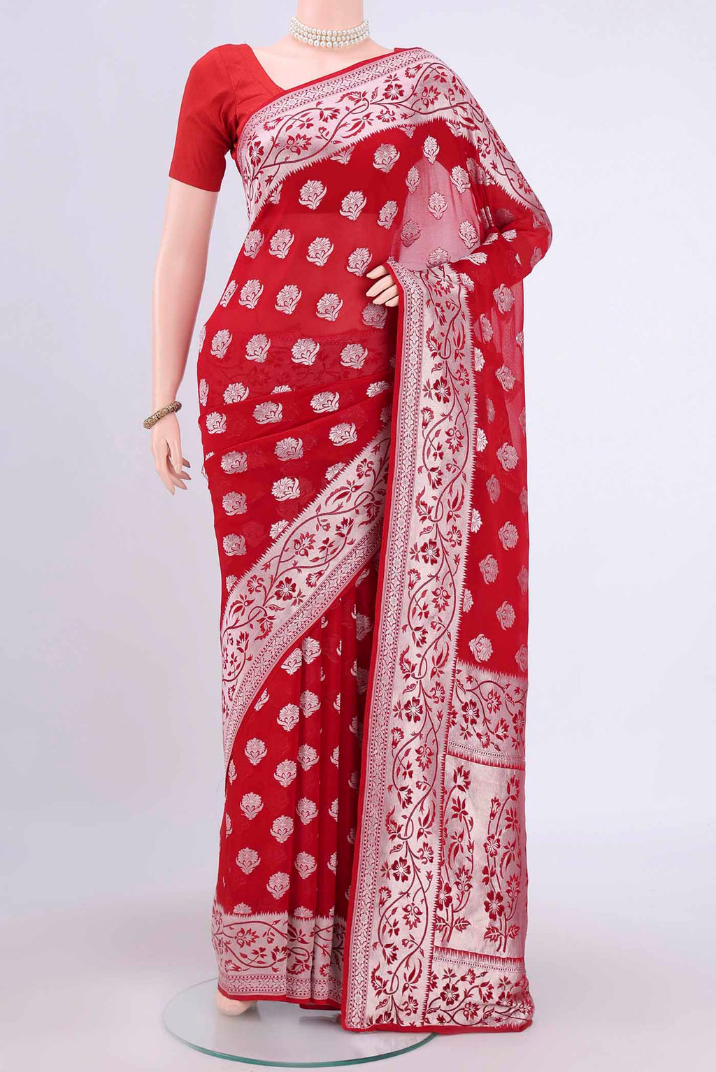 Red Banarasi Georgette Saree with Zari Brocade on the body and Zari Border.  displayed on a mannequin