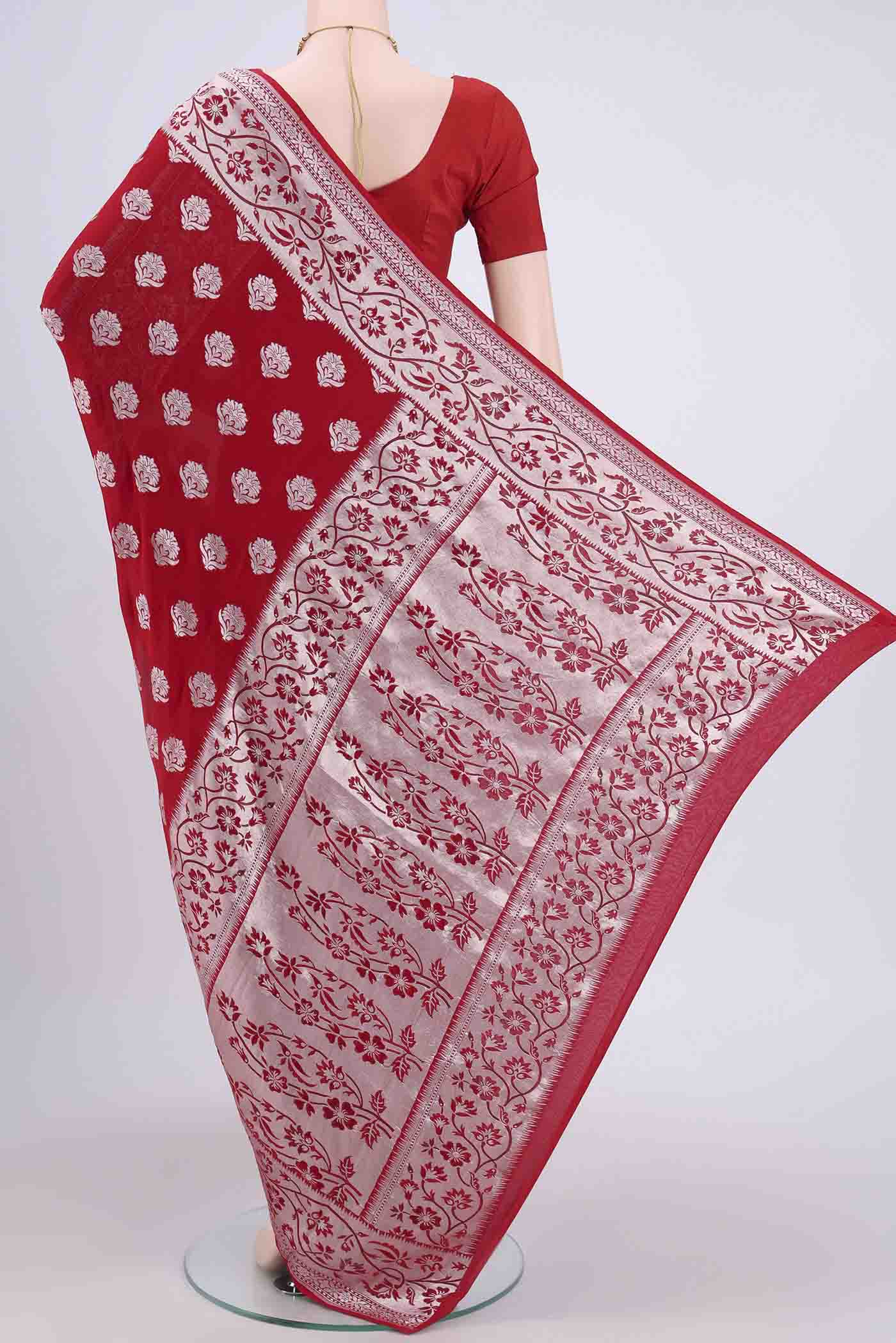 Flat view of Red Banarasi Georgette Saree with Zari Brocade on the body and Zari Border. 