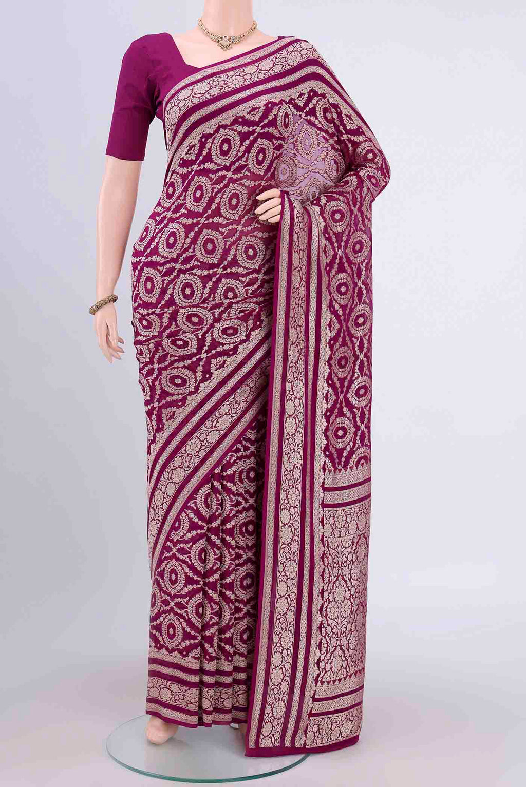 Purple Banarasi Georgette Saree with Zari Brocade on the body and Zari Border.  displayed on a mannequin