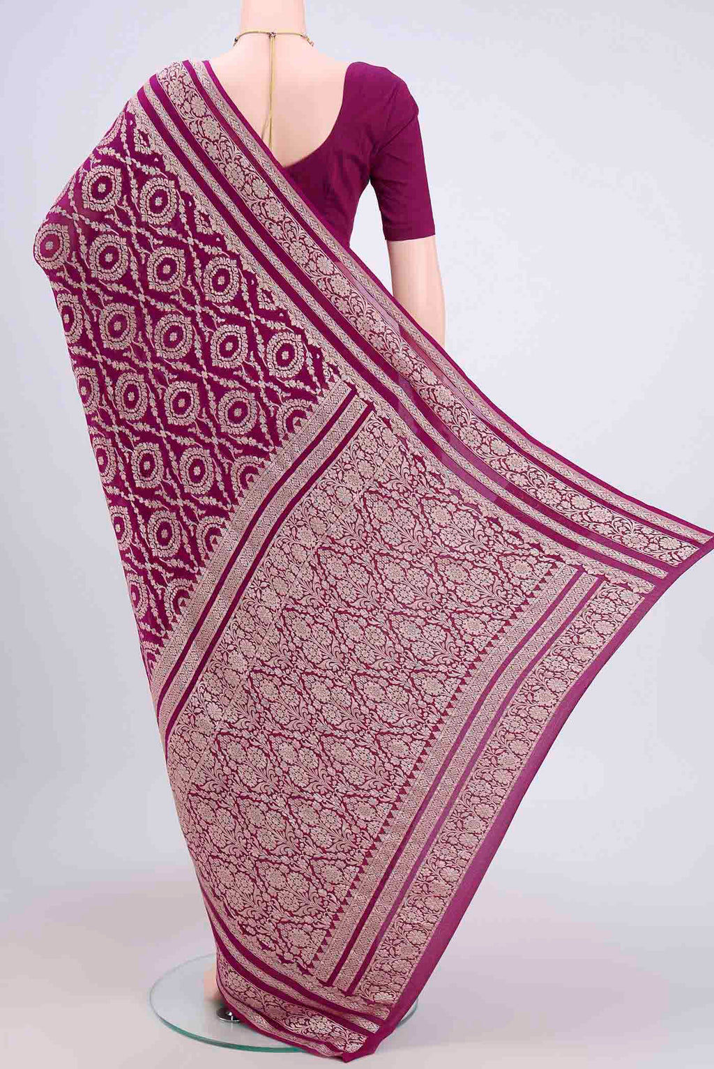 Flat view of Purple Banarasi Georgette Saree with Zari Brocade on the body and Zari Border. 