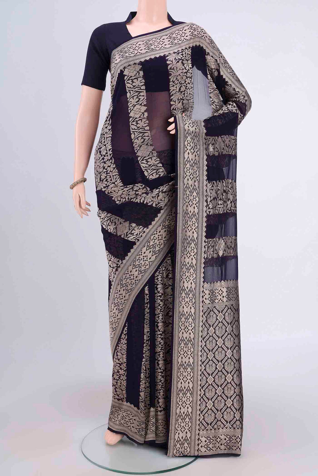 Navy Blue Banarasi Georgette Saree with Zari Brocade on the body and Zari Border.  displayed on a mannequin