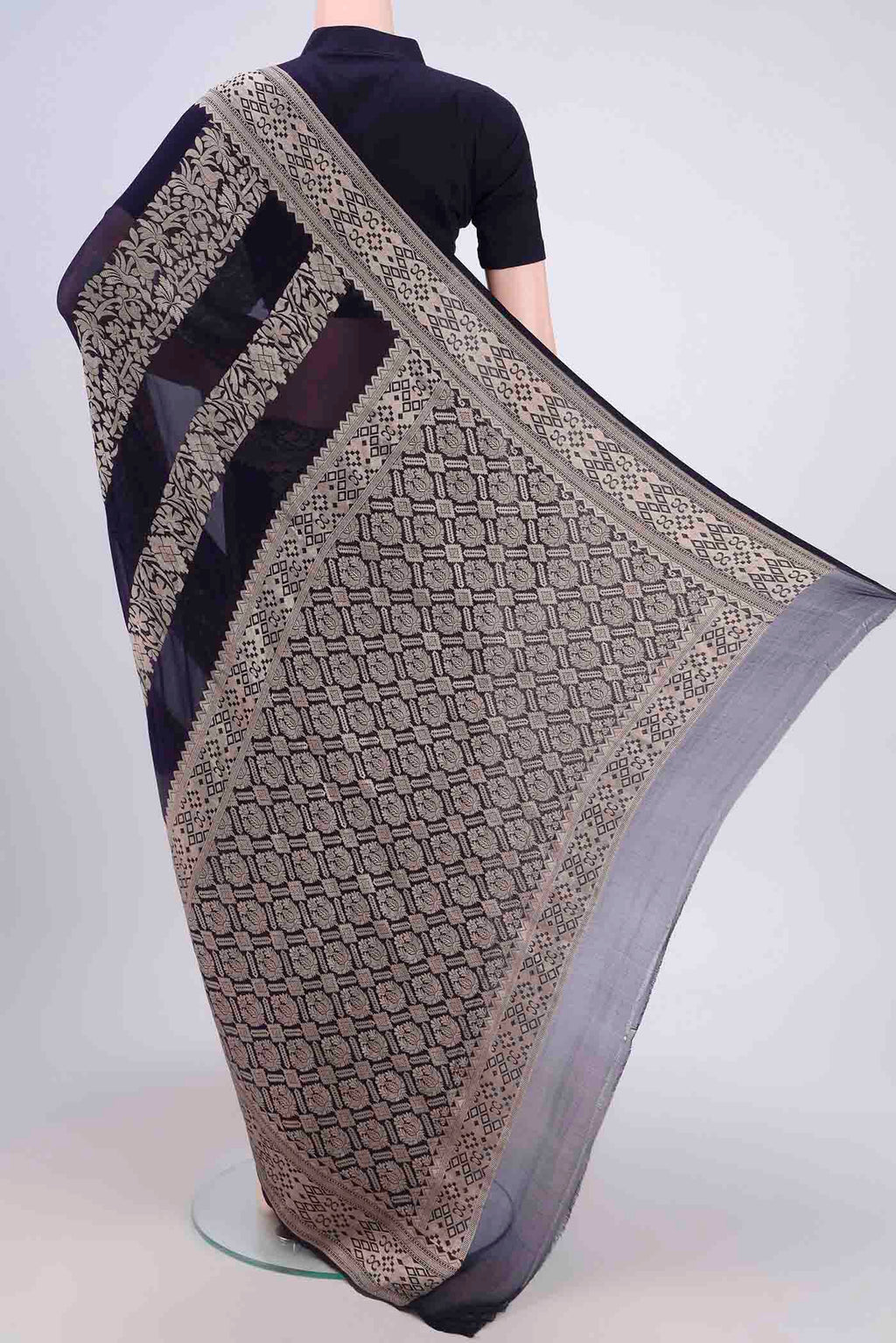 Flat view of Navy Blue Banarasi Georgette Saree with Zari Brocade on the body and Zari Border. 