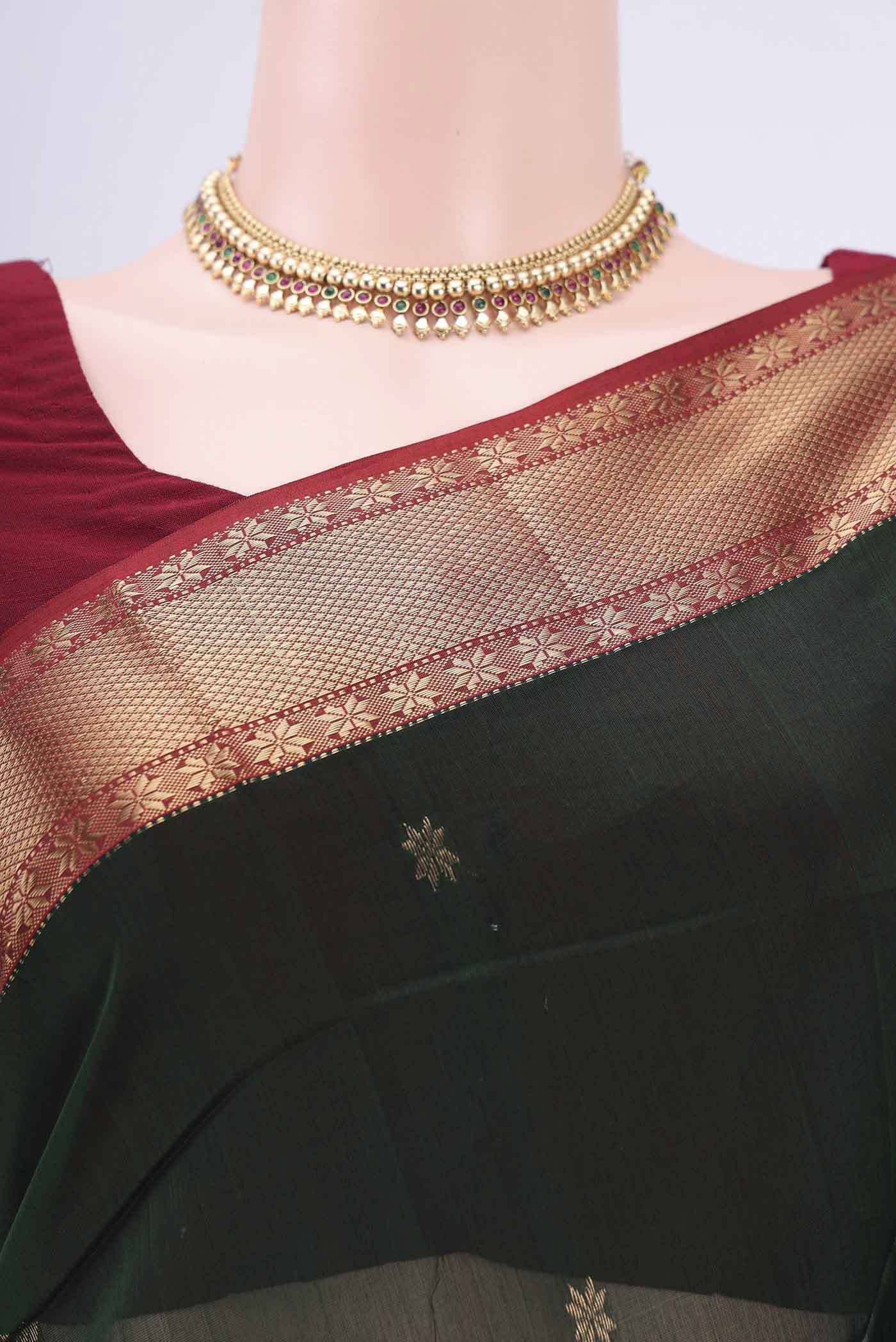 Border image of Bottle Green Maheshwari Silk Cotton Saree with Zari Butta on the body and Zari Border. 