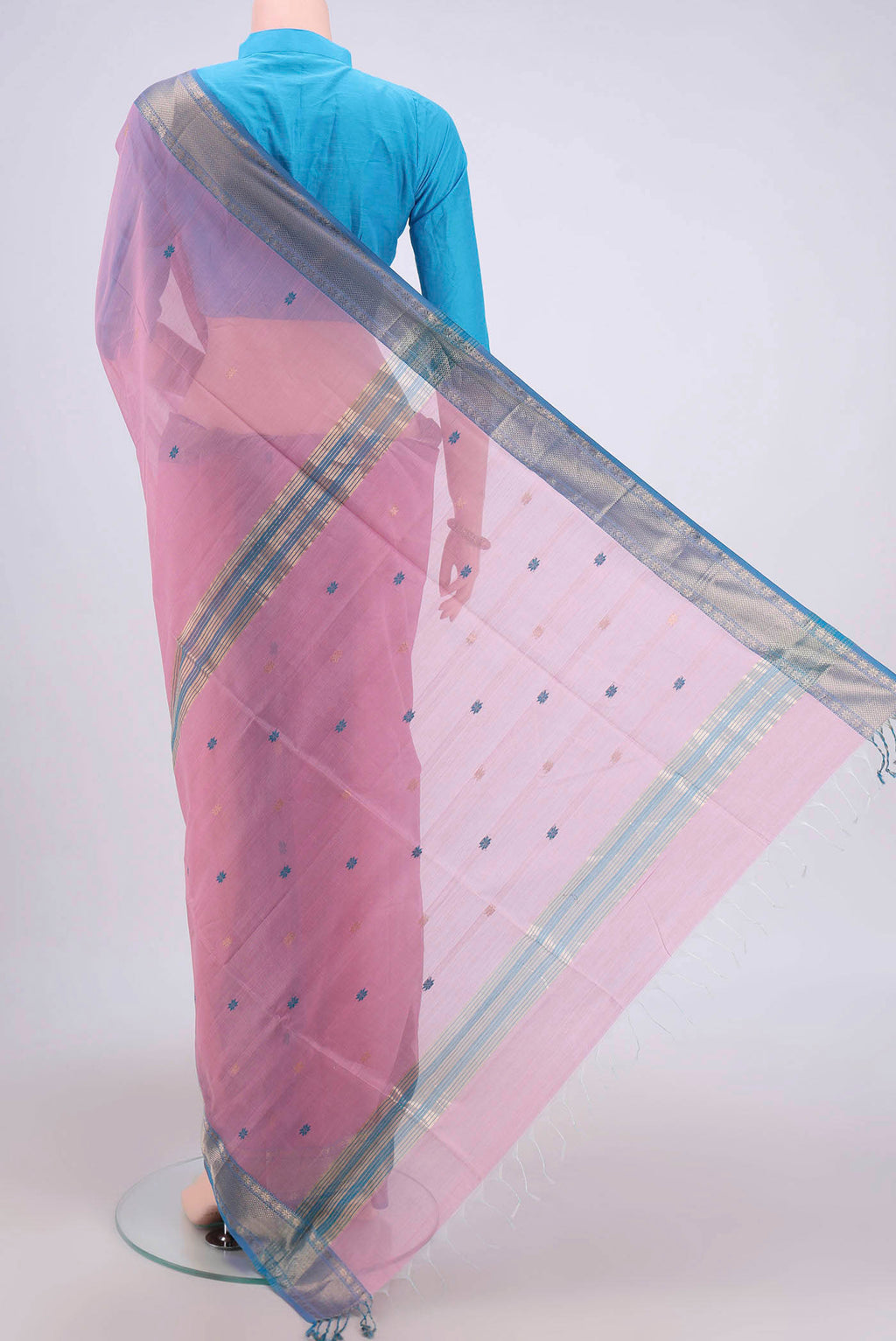 Flat view of Pink Maheshwari Silk Cotton Saree with Stripes on the body and Zari Border. 